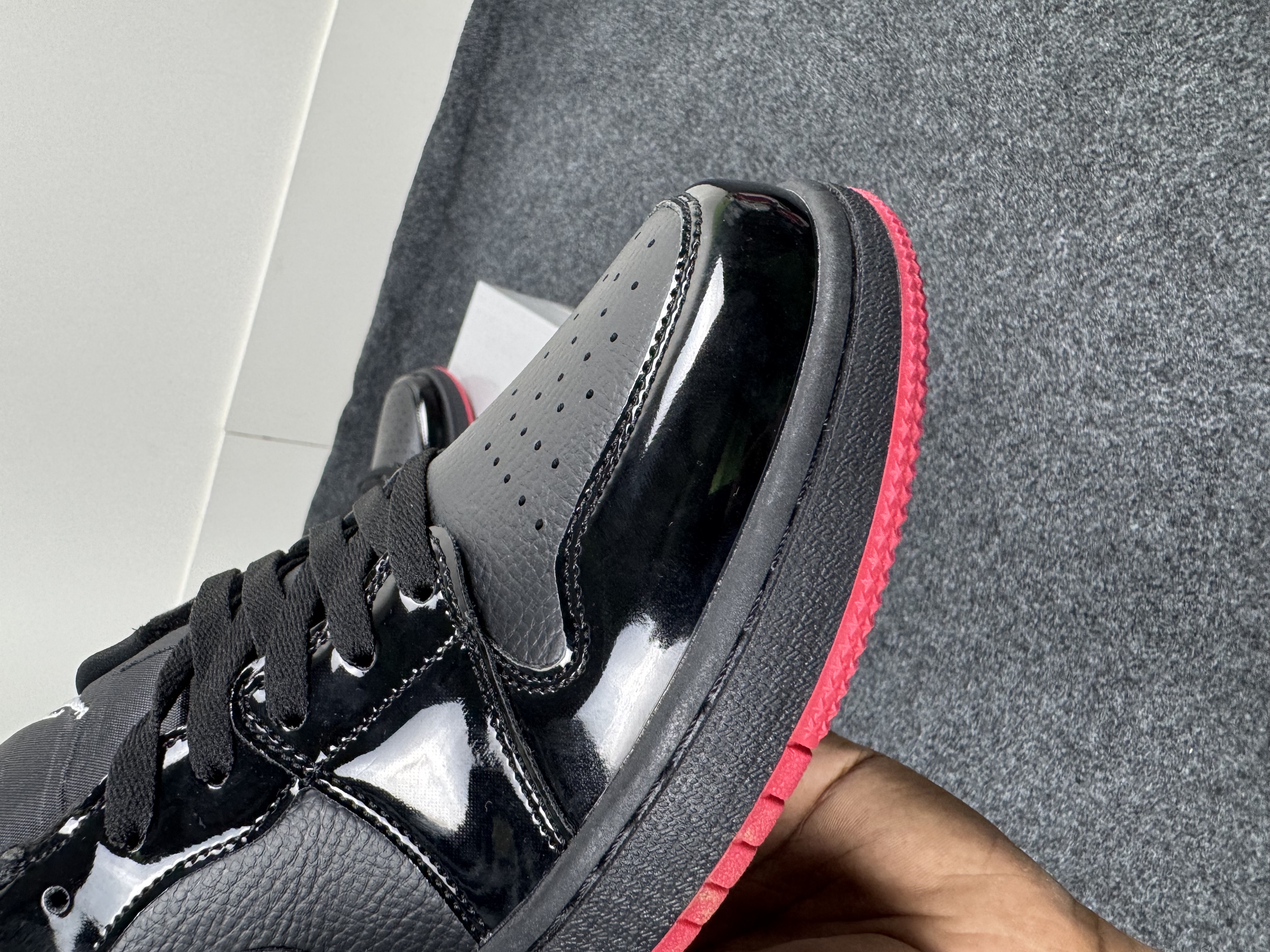 Air Jordan 1 Low: "glossy black & red outsole" thumbnail 4