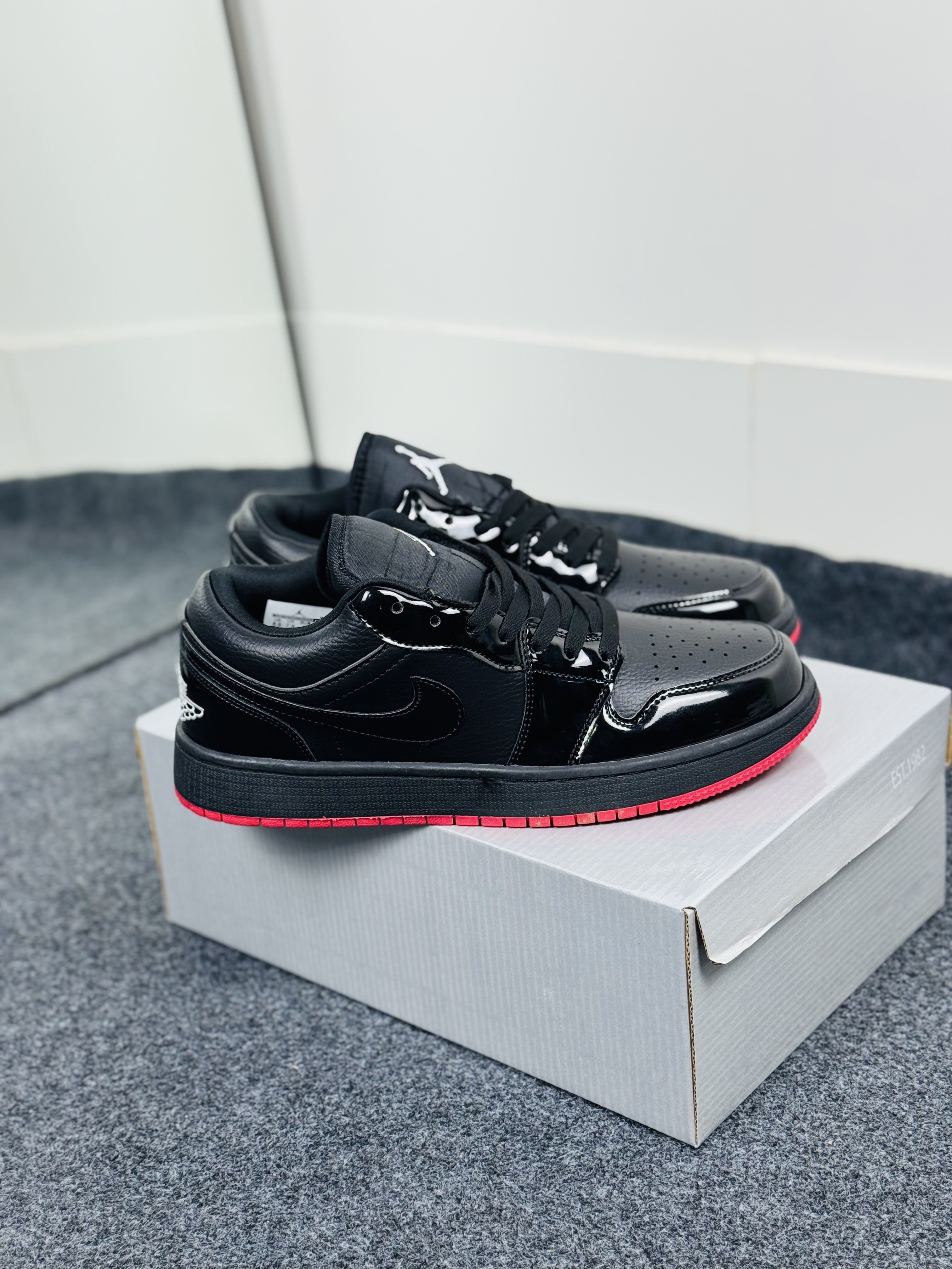 Air Jordan 1 Low: "glossy black & red outsole"