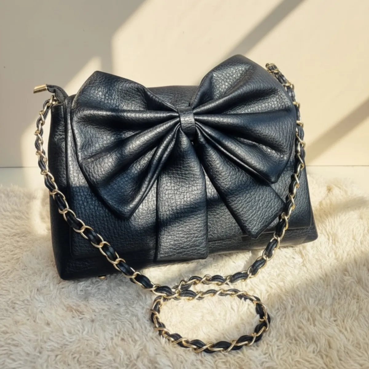 Elegant Black Bow Crossbody Bag with Golden Chain - Image 1