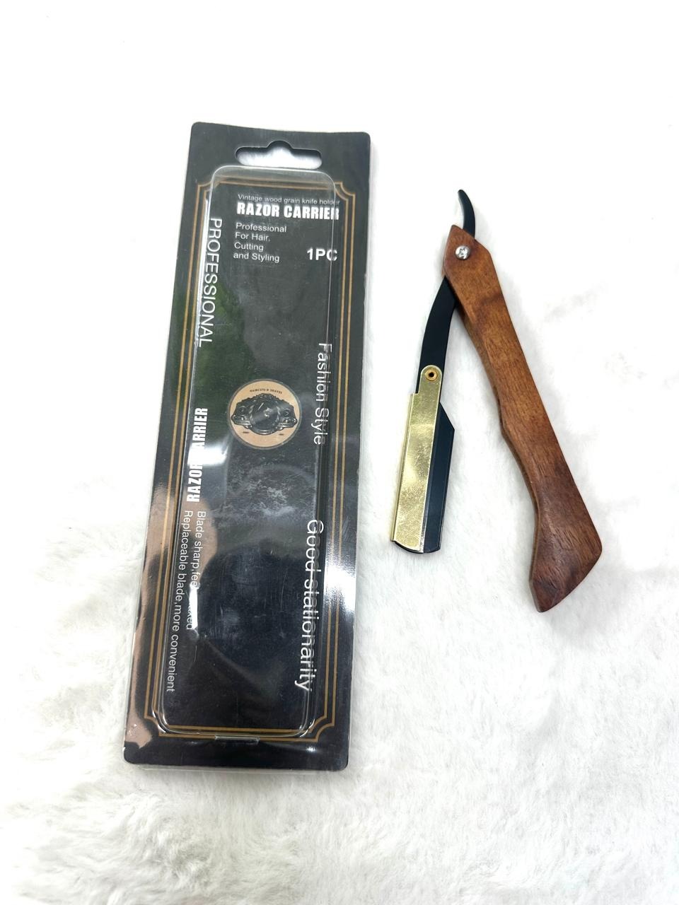Professional barber straight edge razor featuring a foldable wooden handle and a stainless steel blade holder. thumbnail 3