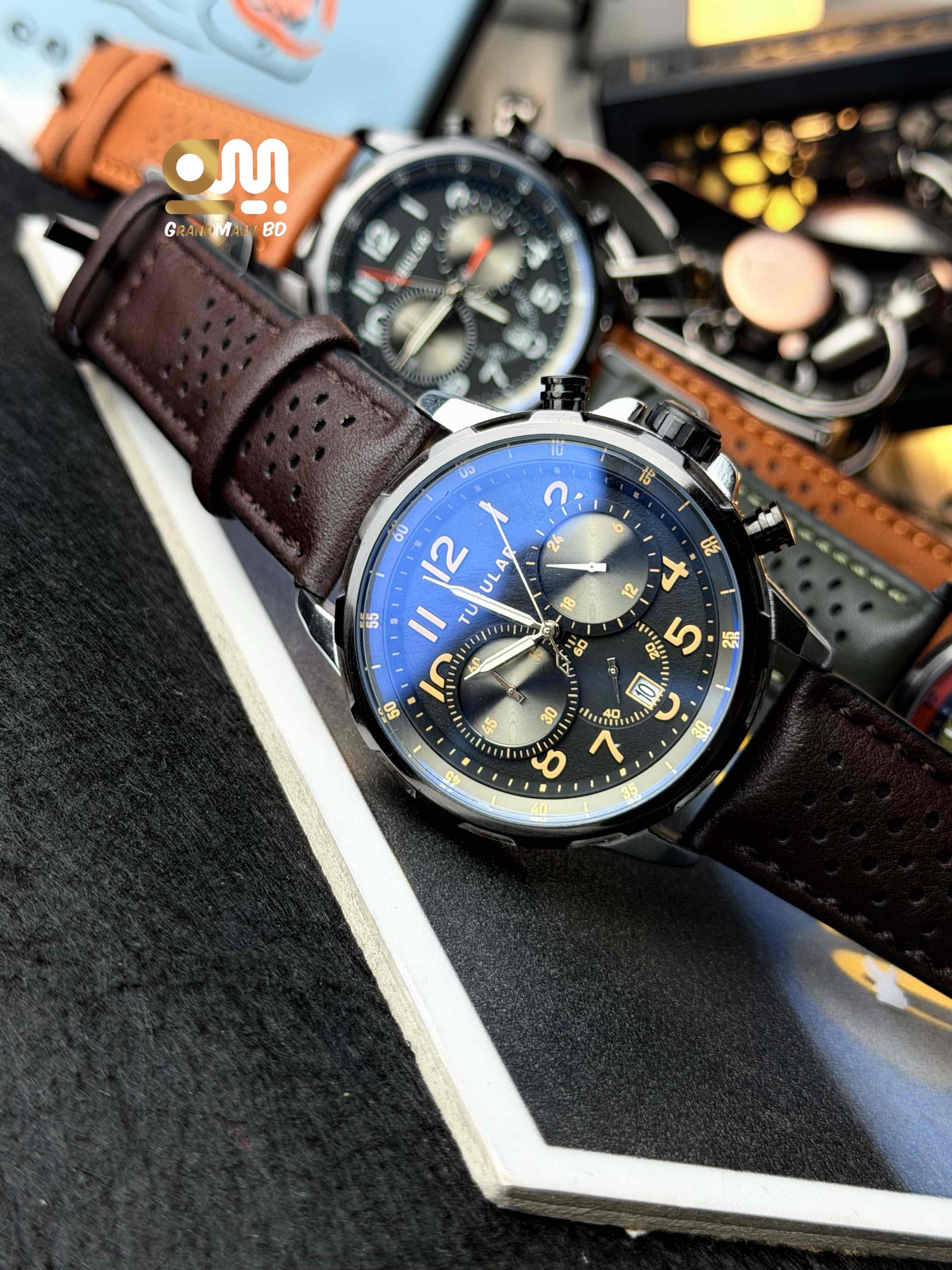 Tubular Analog Quartz Chronograph Watch featuring a dark textured dial with orange numerical markers and a perforated brown leather strap_img_2