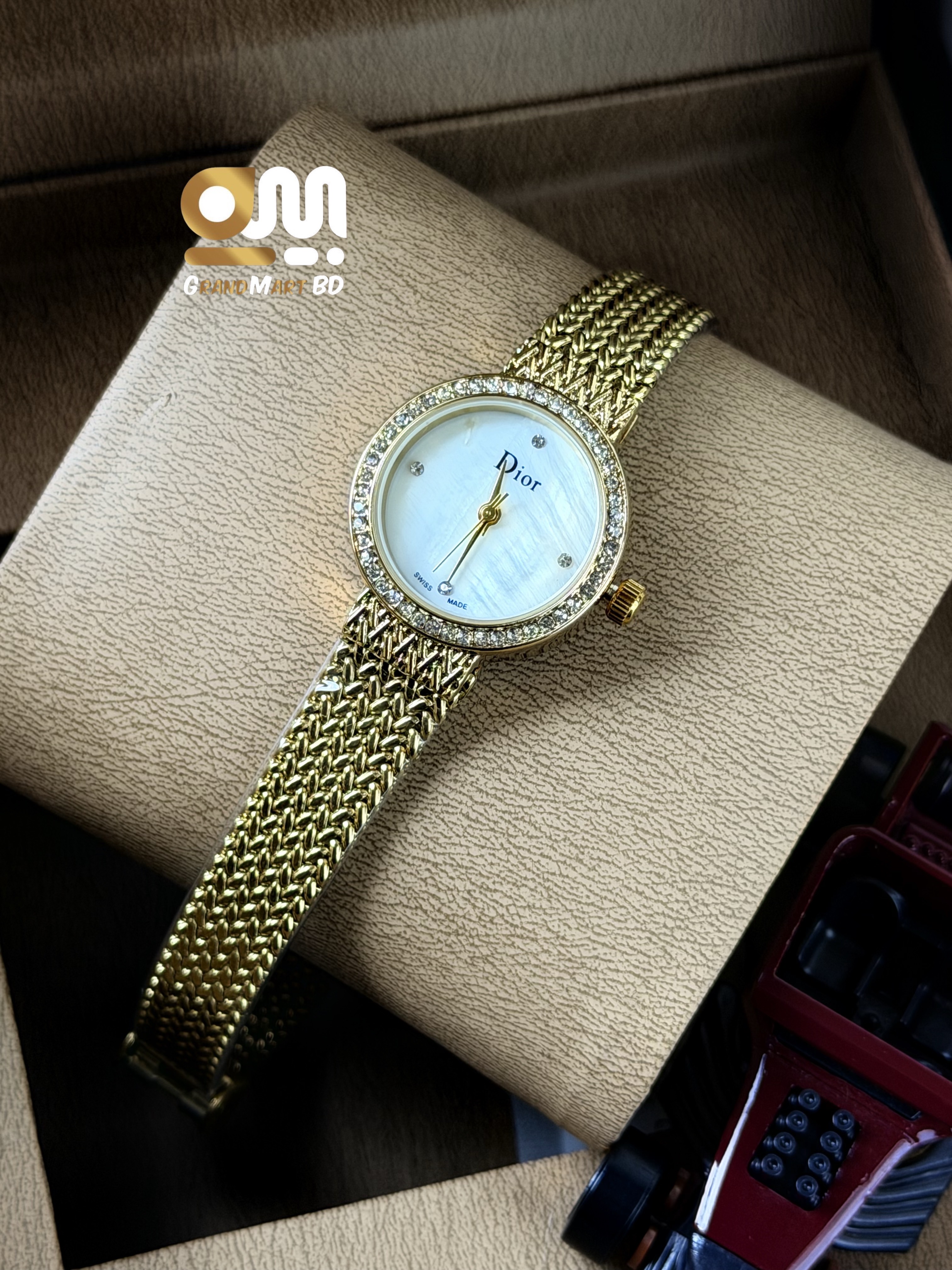 Dior La D de Dior women's gold-tone mesh bracelet watch featuring a mother-of-pearl dial and a crystal-set bezel