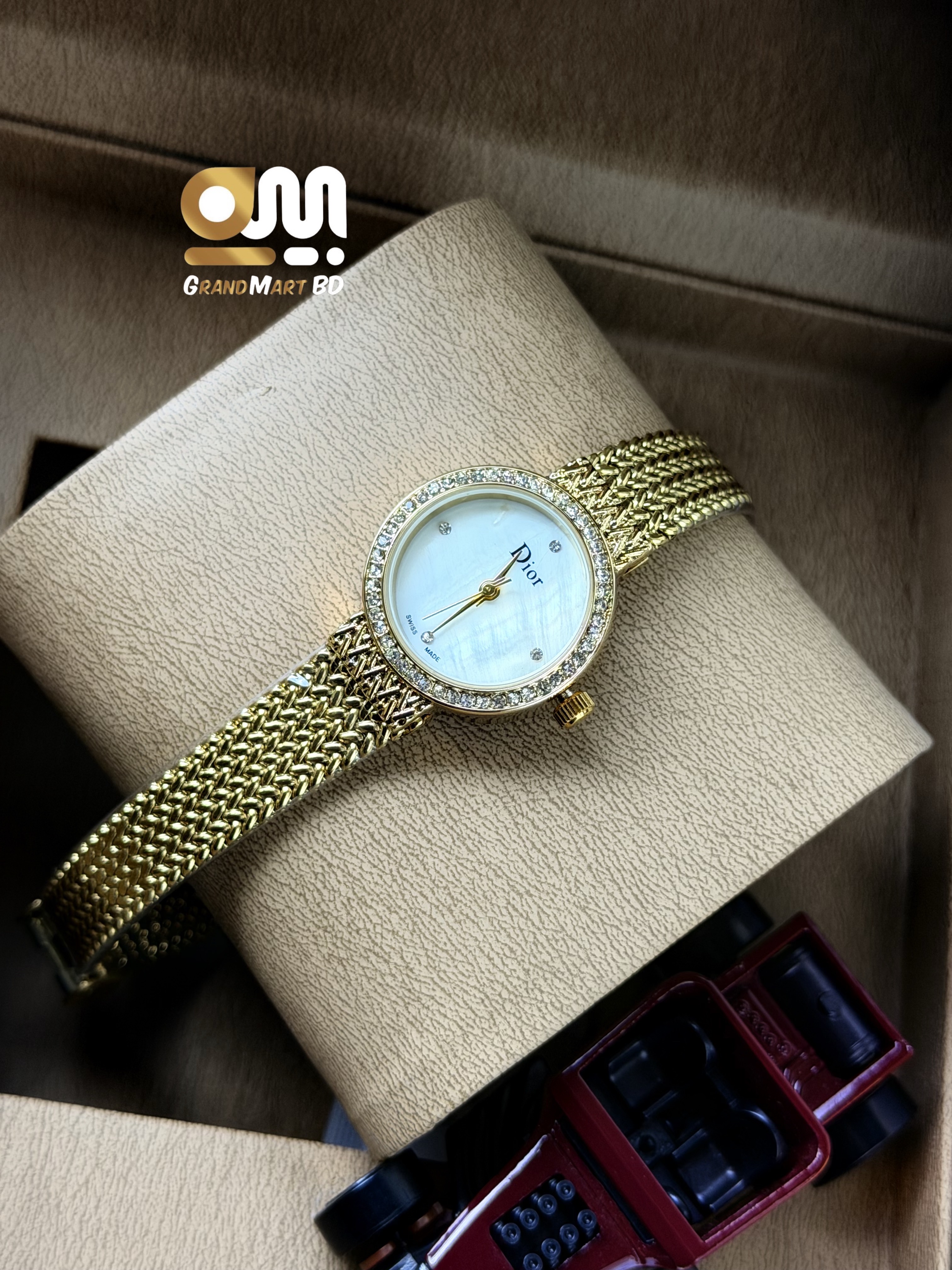 Dior La D de Dior women's gold-tone mesh bracelet watch featuring a mother-of-pearl dial and a crystal-set bezel_img_1