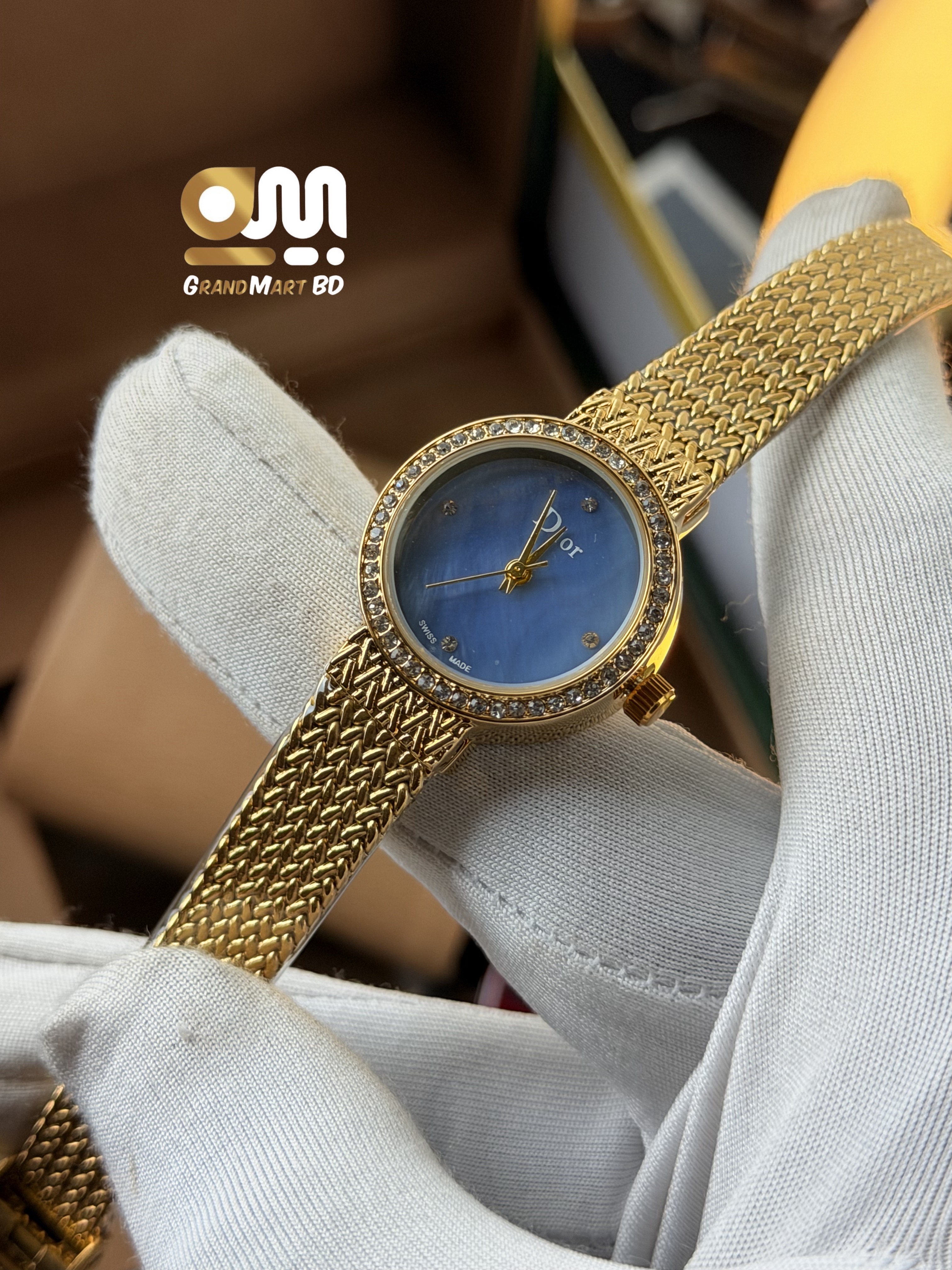 Dior La D de Dior women's gold-tone mesh bracelet watch featuring a mother-of-pearl dial and a crystal-set bezel