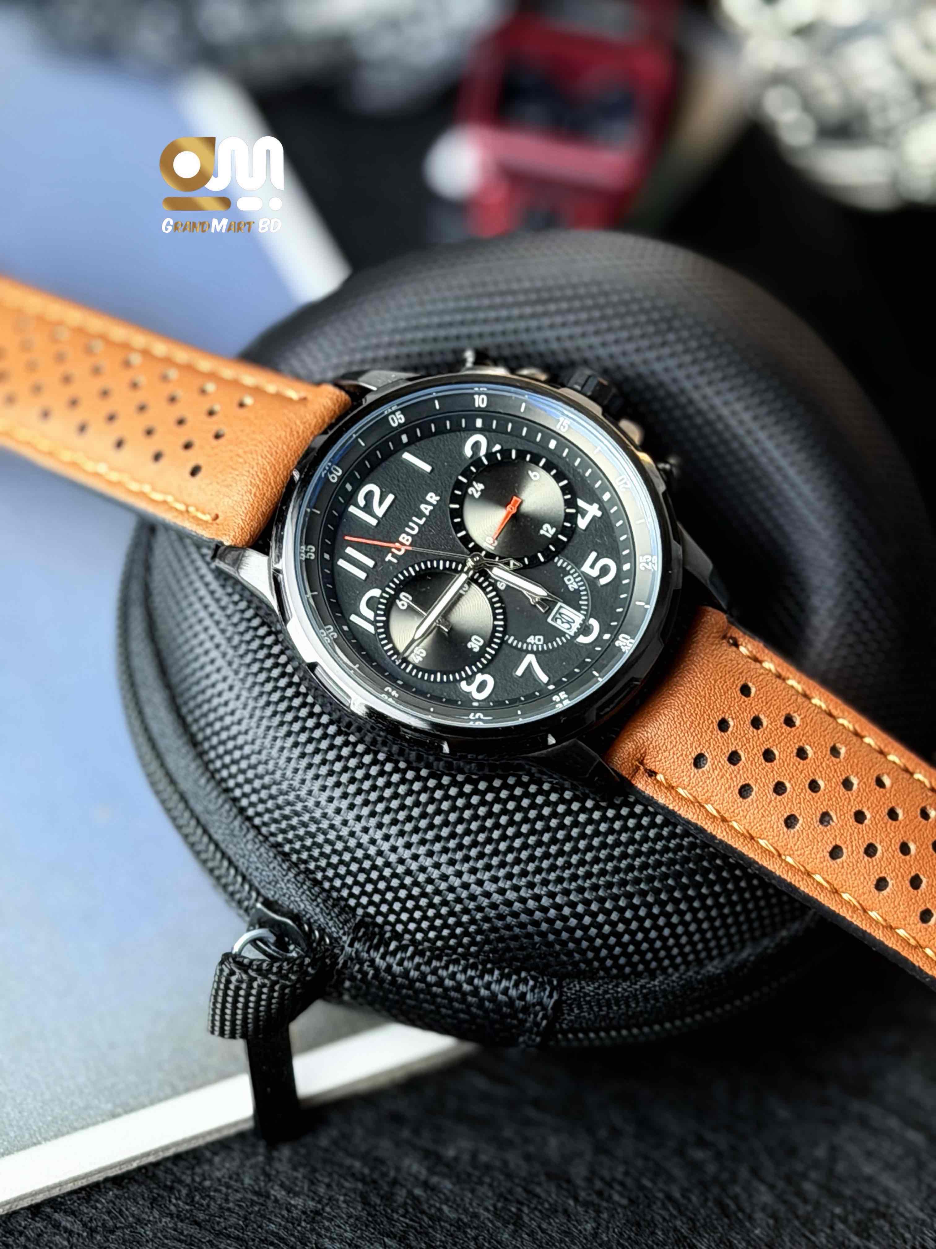 y Tubular chronograph watch stands out with its stylish perforated brown leather strap.