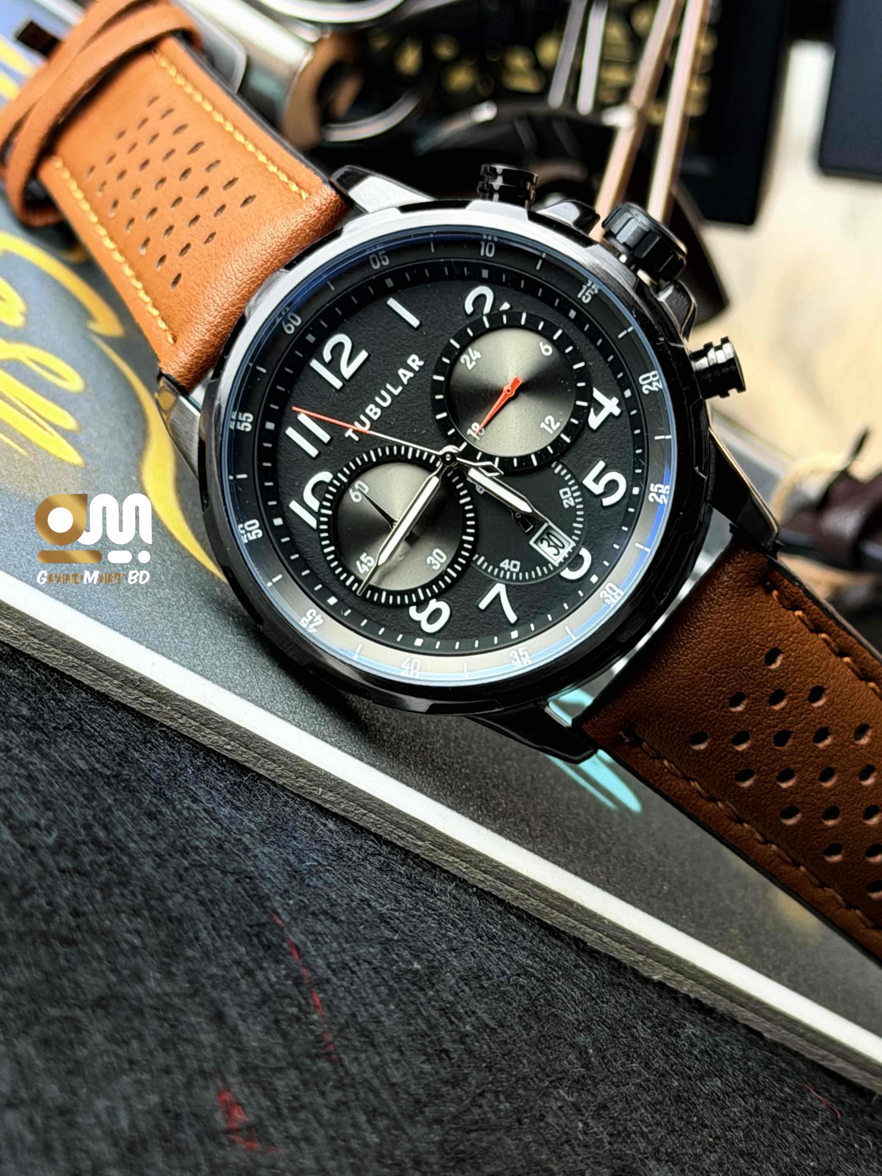 y Tubular chronograph watch stands out with its stylish perforated brown leather strap._img_1