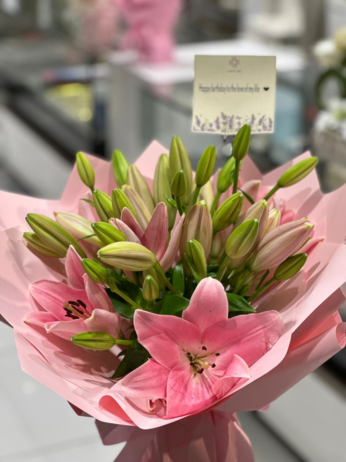 pink lily hand bouquet