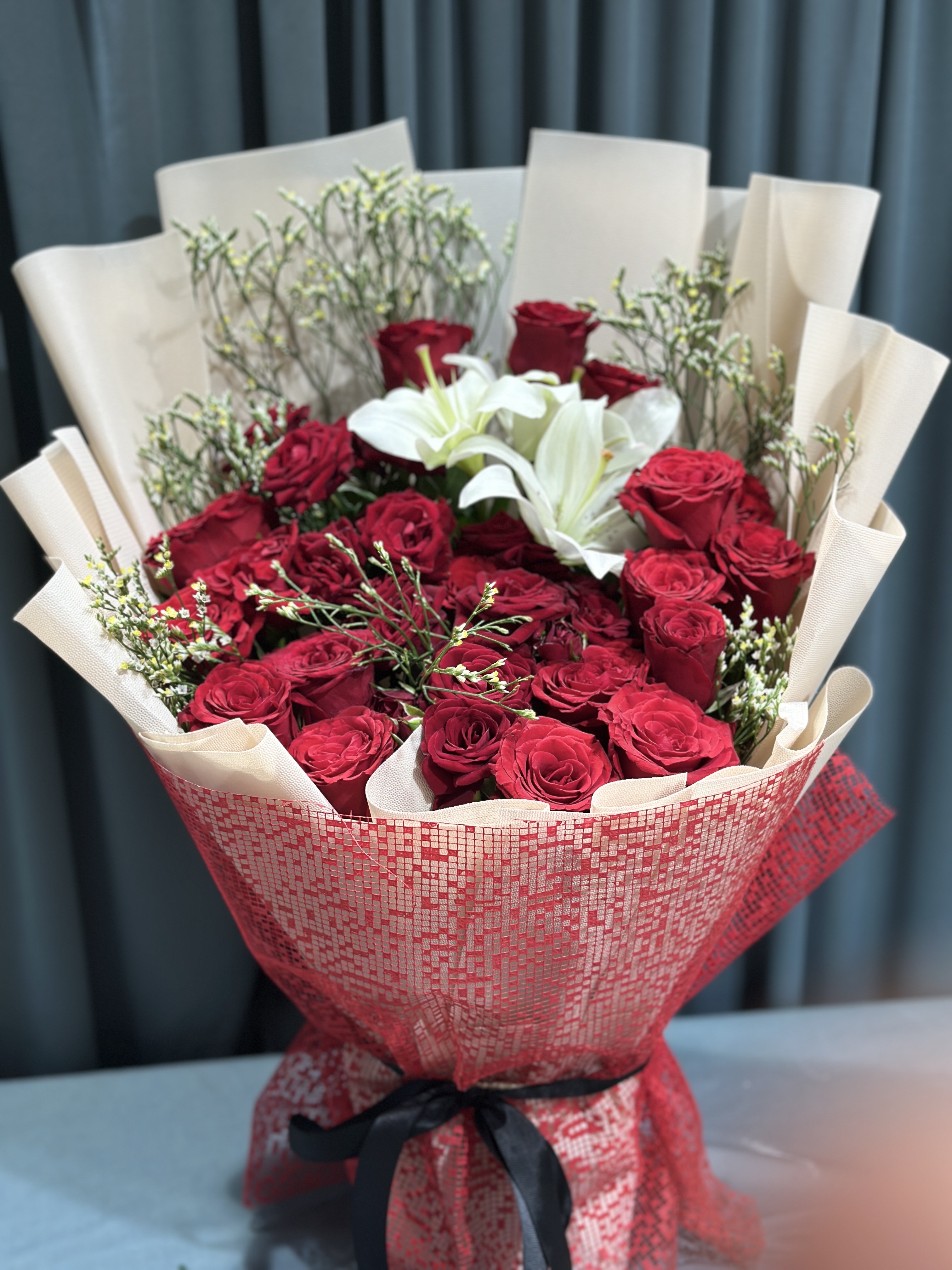 Lily within Red  roses stunning bouquet