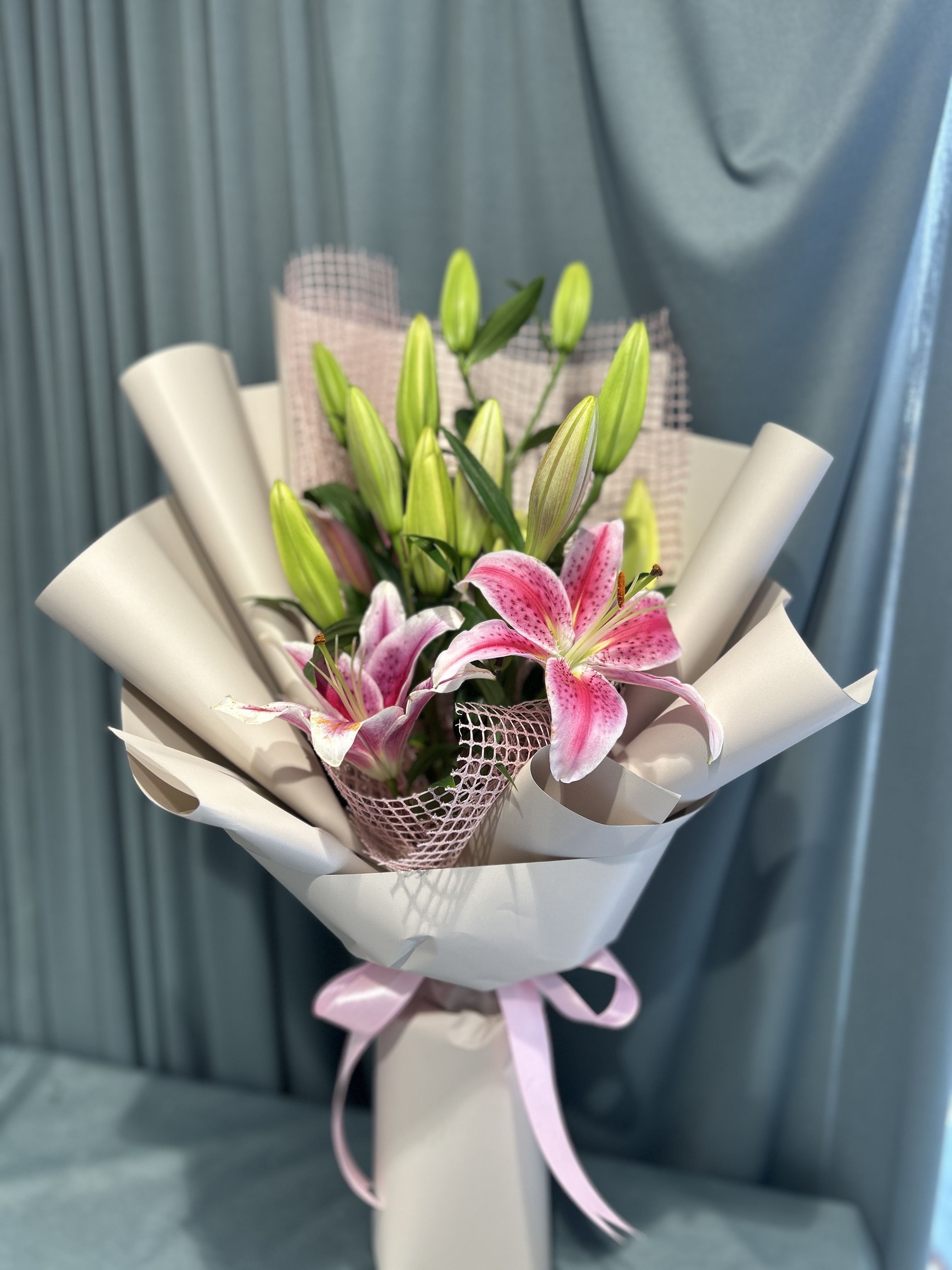 Pink lily’s hand bouquet