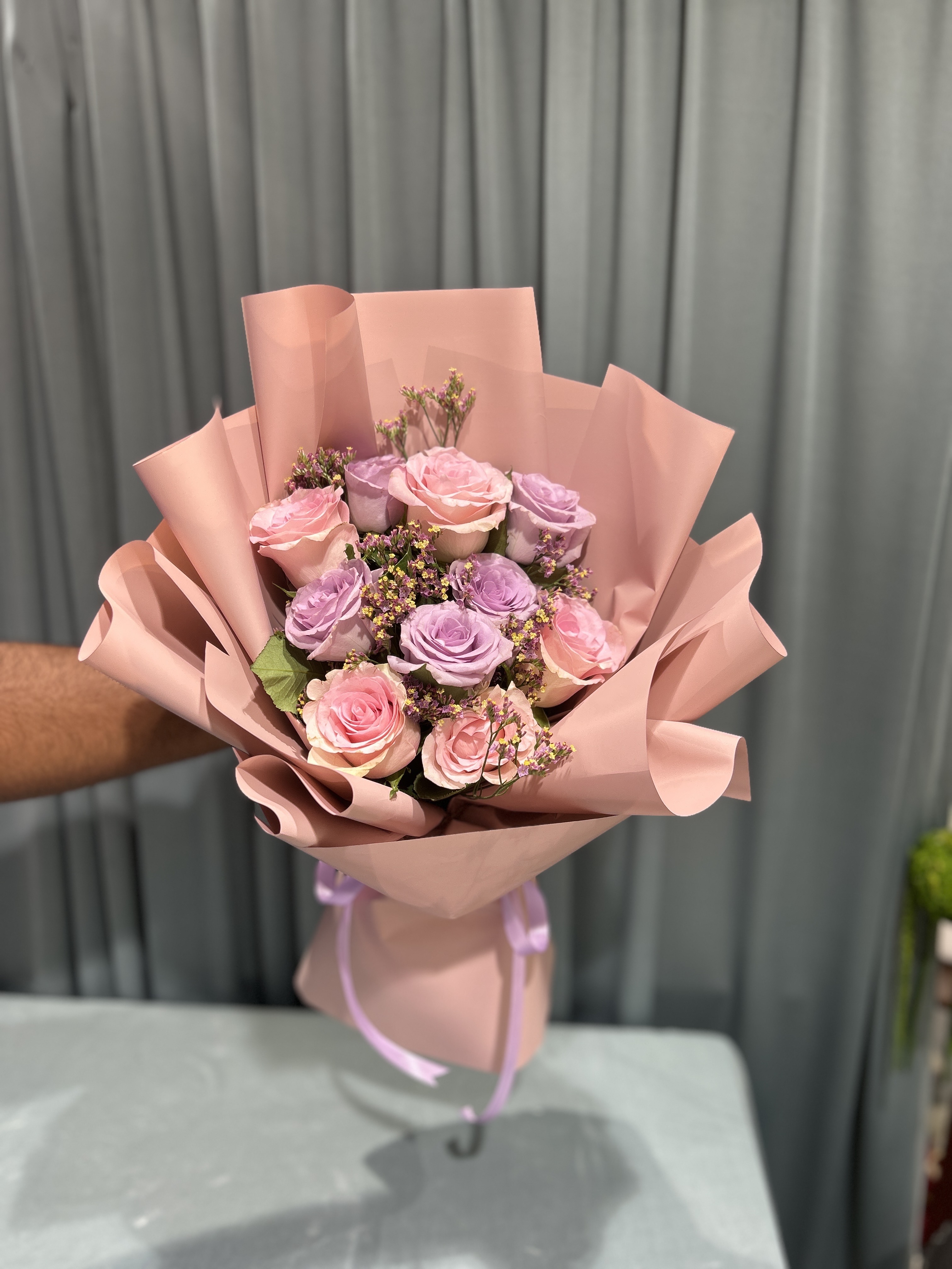 Lite pink and purple hand bouquet