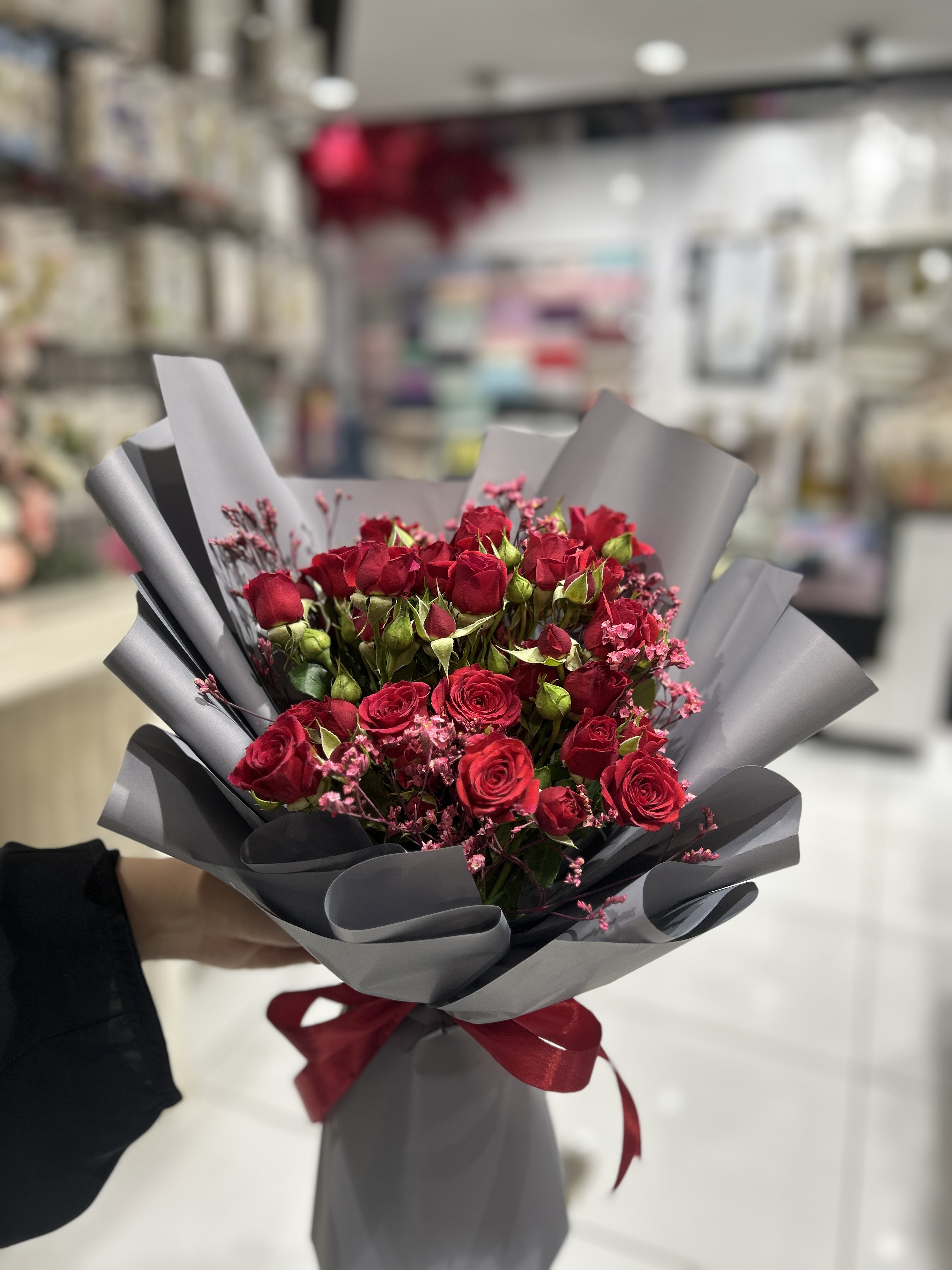 Red baby roses hand bouquet
