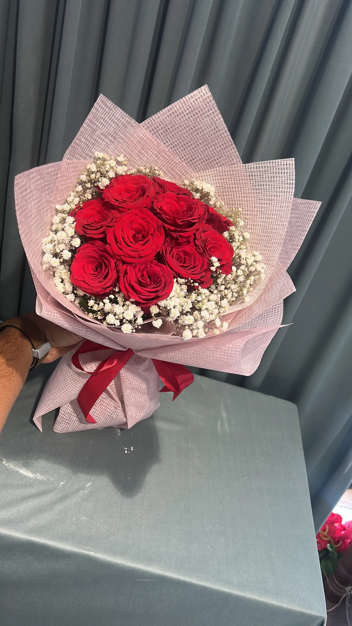 Red and pink hand bouquet