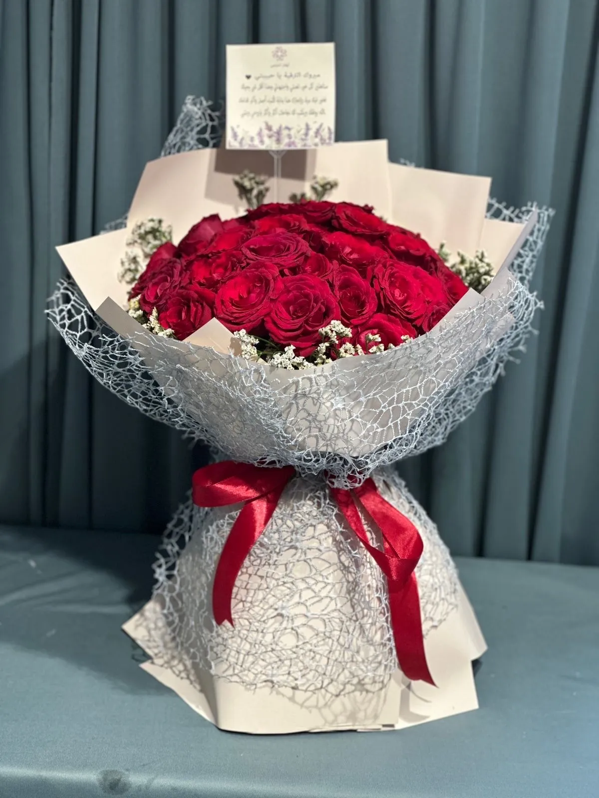 Red roses hand bouquet