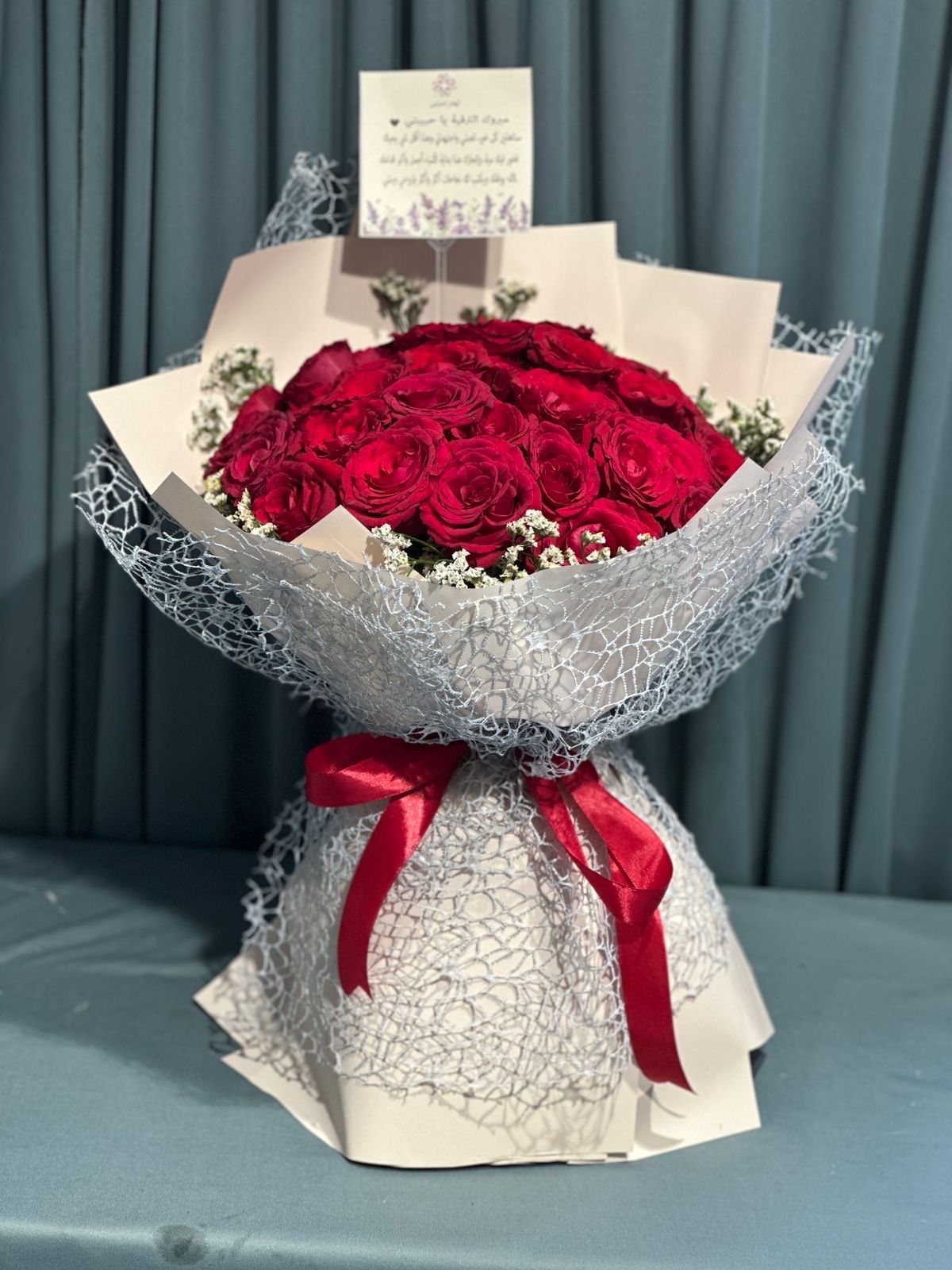 Red roses hand bouquet