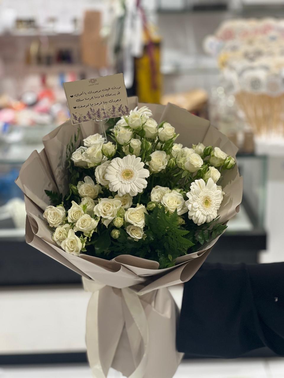 White multiple type flowers hand bouquet