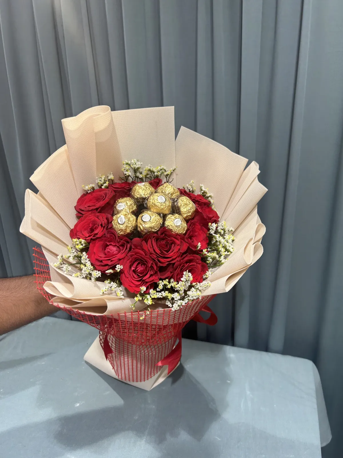 Chocolates within Red flowers