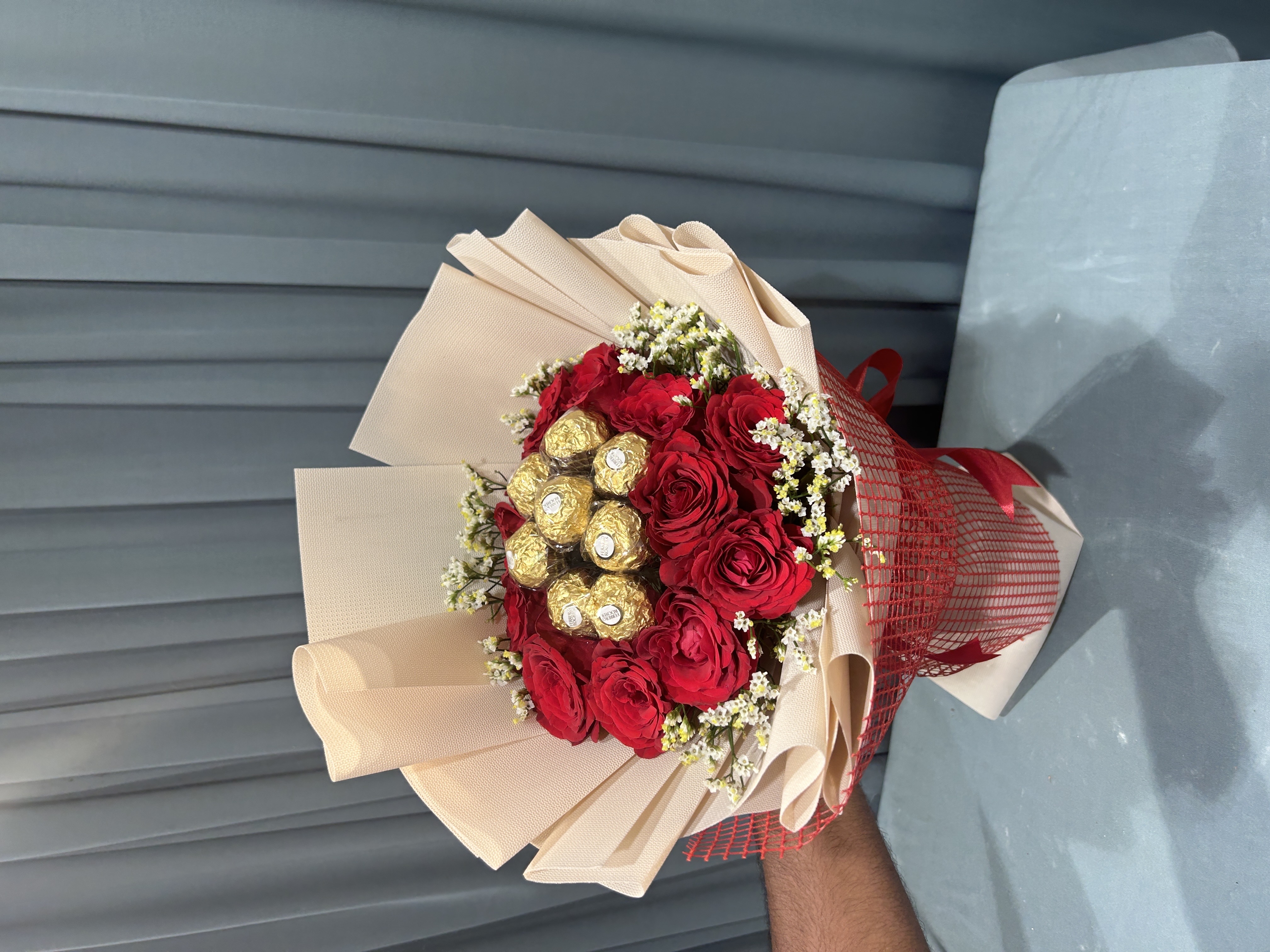 Chocolates within Red flowers