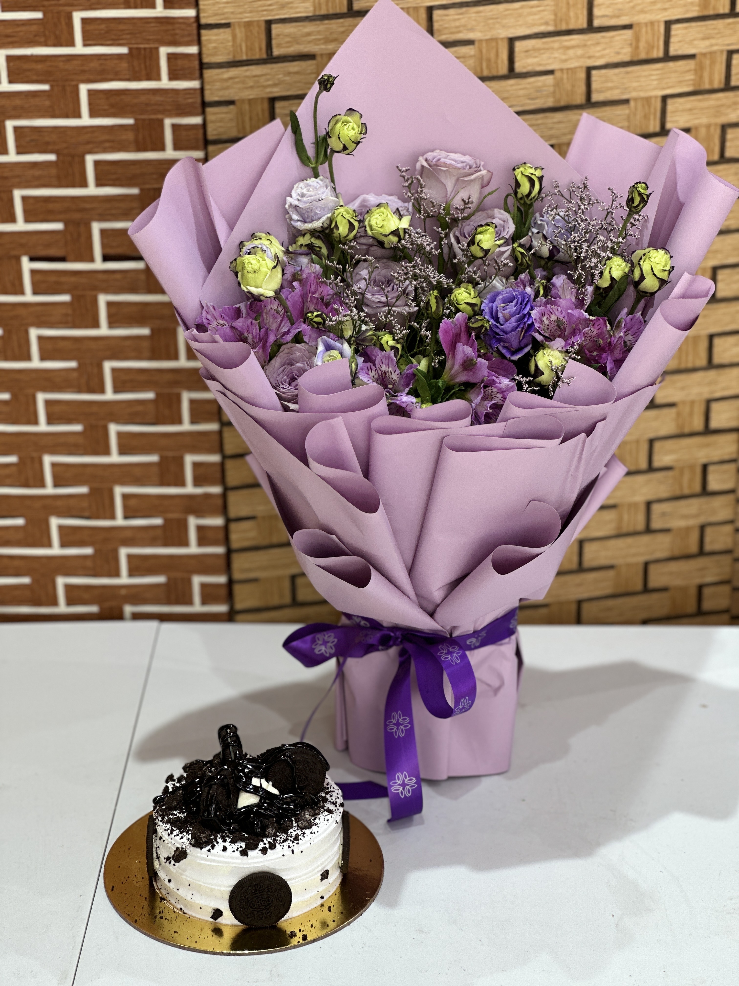 Orio cake with purple flowers stunning bouqu