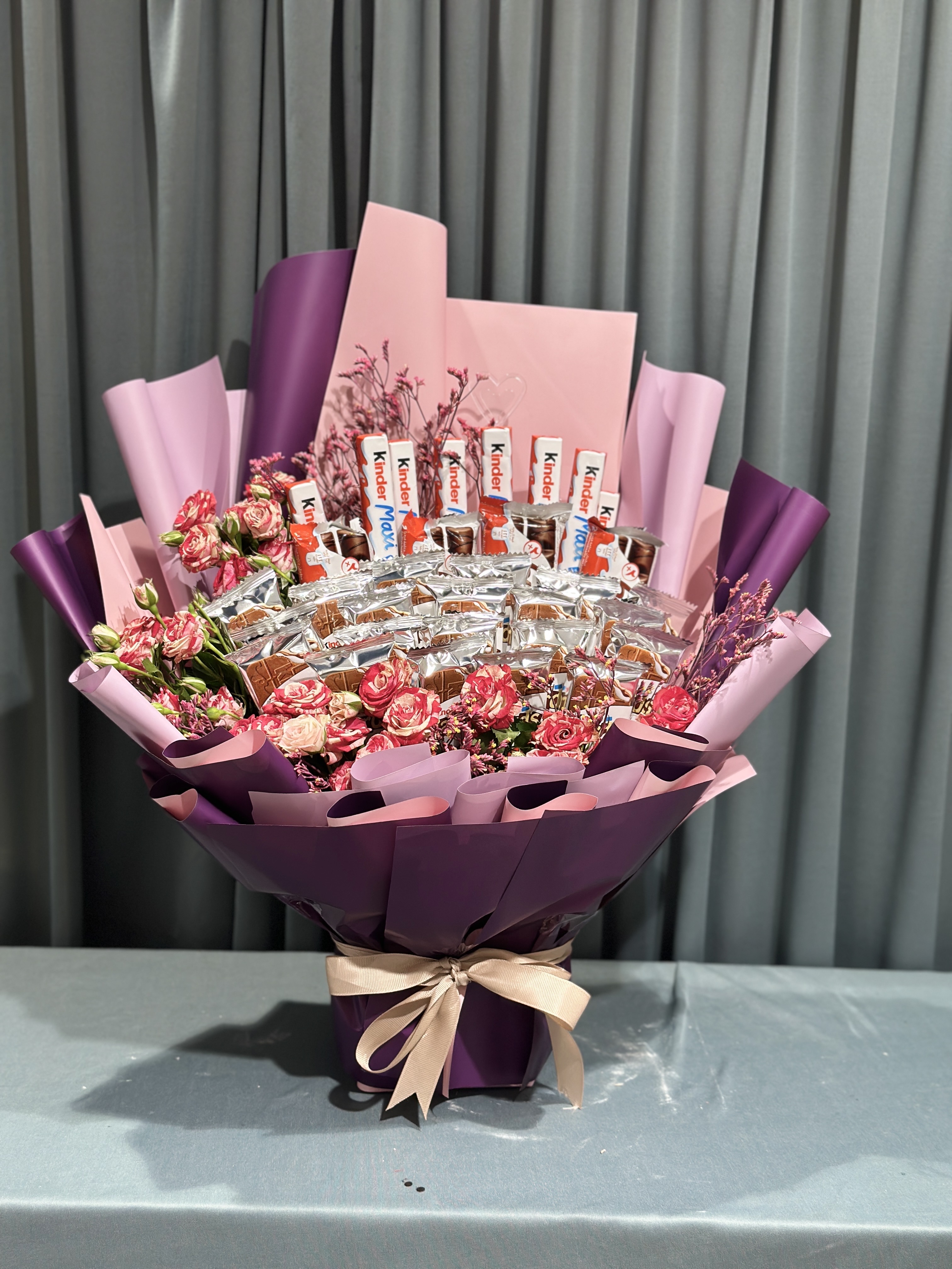 chocolates with baby roses stunning bouquet