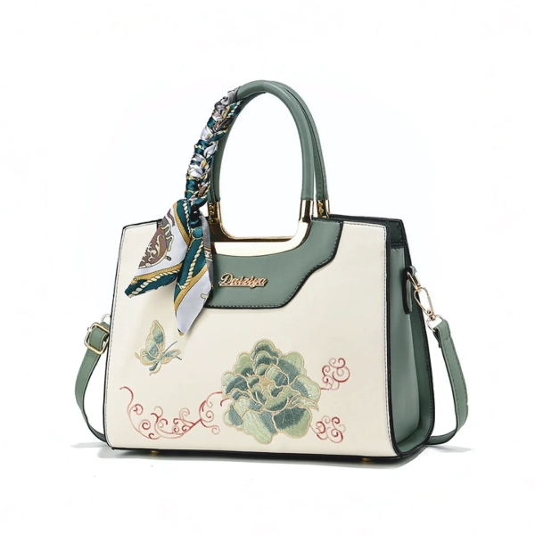 Embroidered Floral & Butterfly Top-Handle Bag with Decorative Scarf and Gold Hardware.