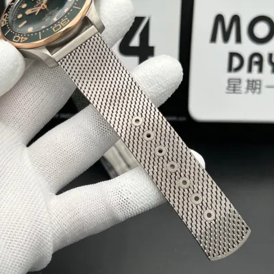Omega Seamaster Diver 300M – Crafted from Grade 2 Titanium and 9K Bronze Gold, Featuring a Green Aluminum Dial and Matching Bezel with a Mesh Bracelet. Swiss 1:1 Grade (Pre-Order)_img_7