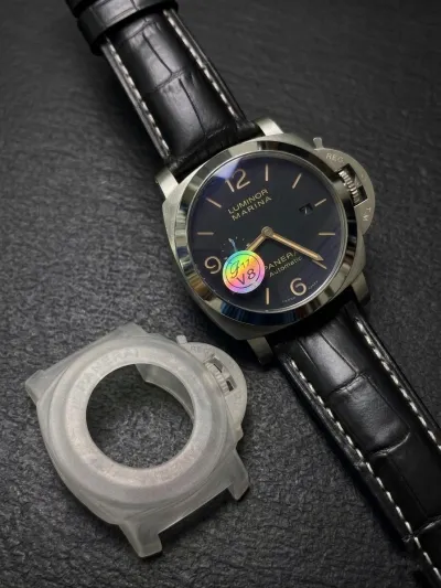 This watch is a Panerai Luminor Marina, likely model PAM01312 or a similar 44mm Luminor 1950 variant, featuring a black dial and a black leather strap._img_0