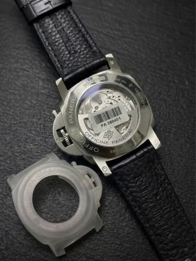This watch is a Panerai Luminor Marina, likely model PAM01312 or a similar 44mm Luminor 1950 variant, featuring a black dial and a black leather strap._img_1
