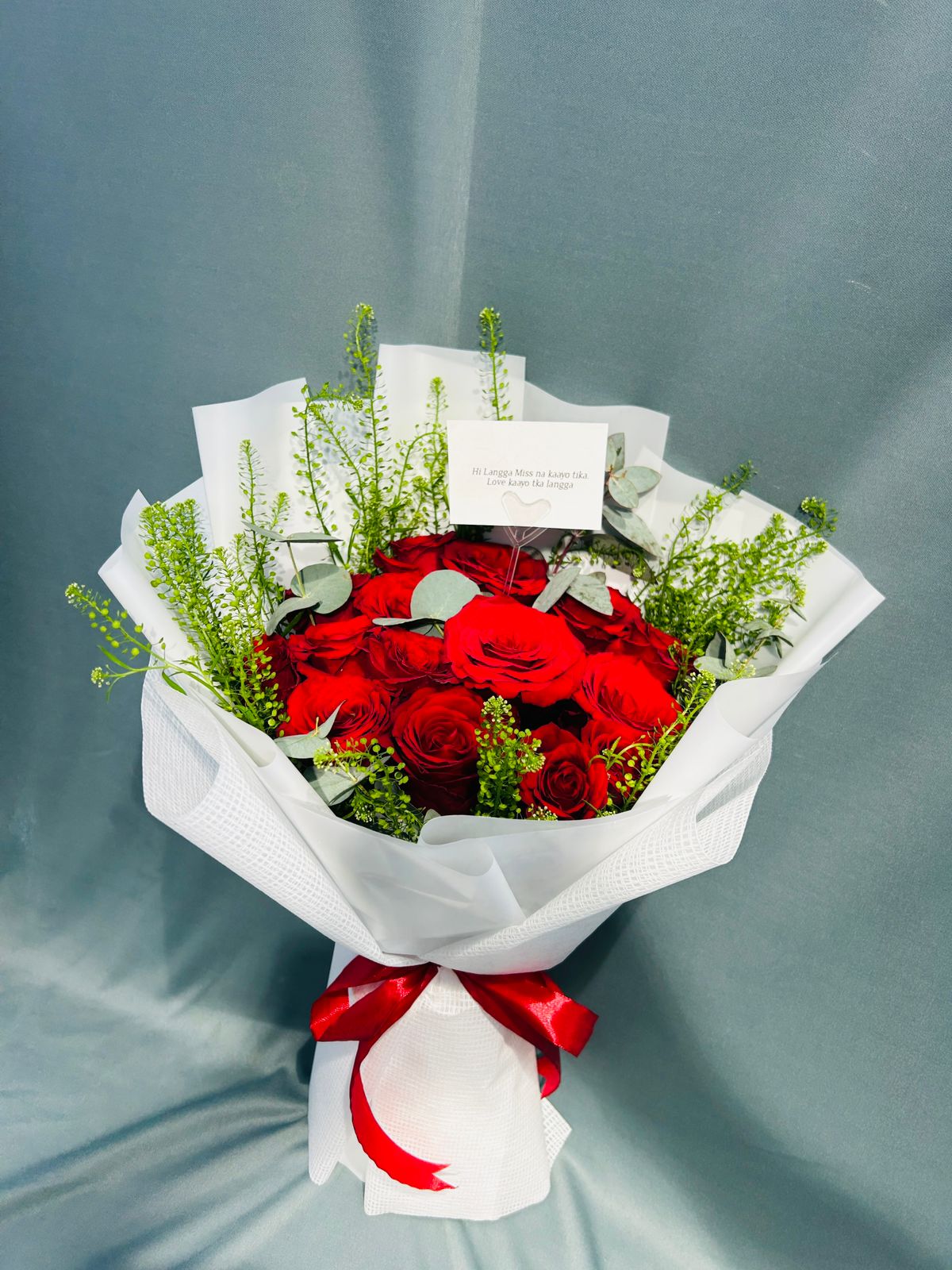 Red roses hand bouquet