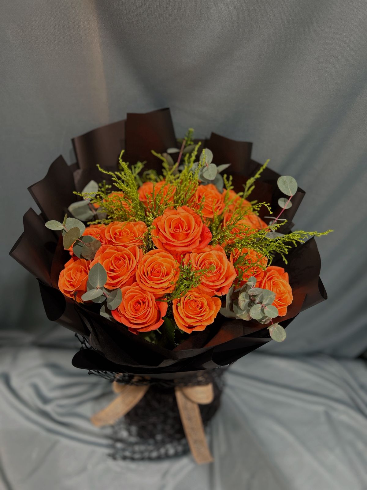 Orange and black  hand bouquet