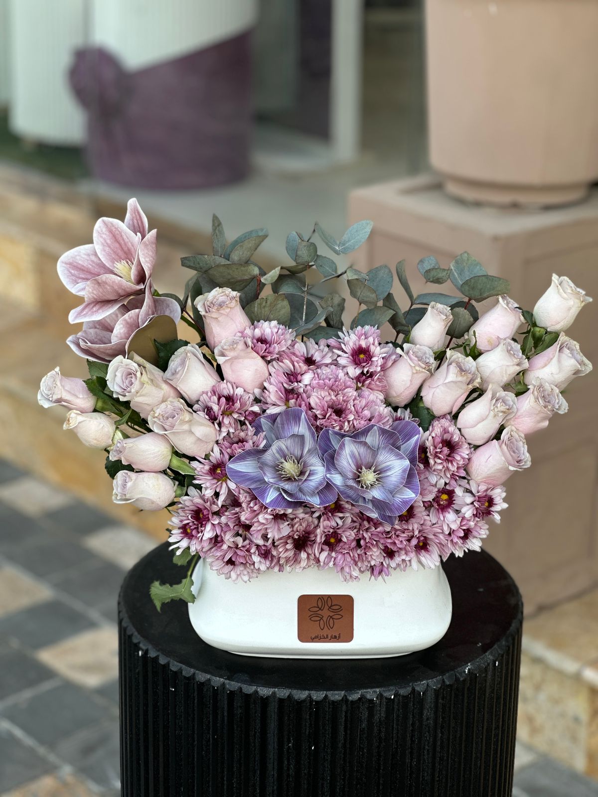 Purple fresh and artificial mix vase