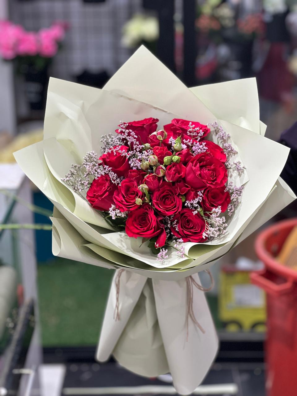 Red roses hand bouquet