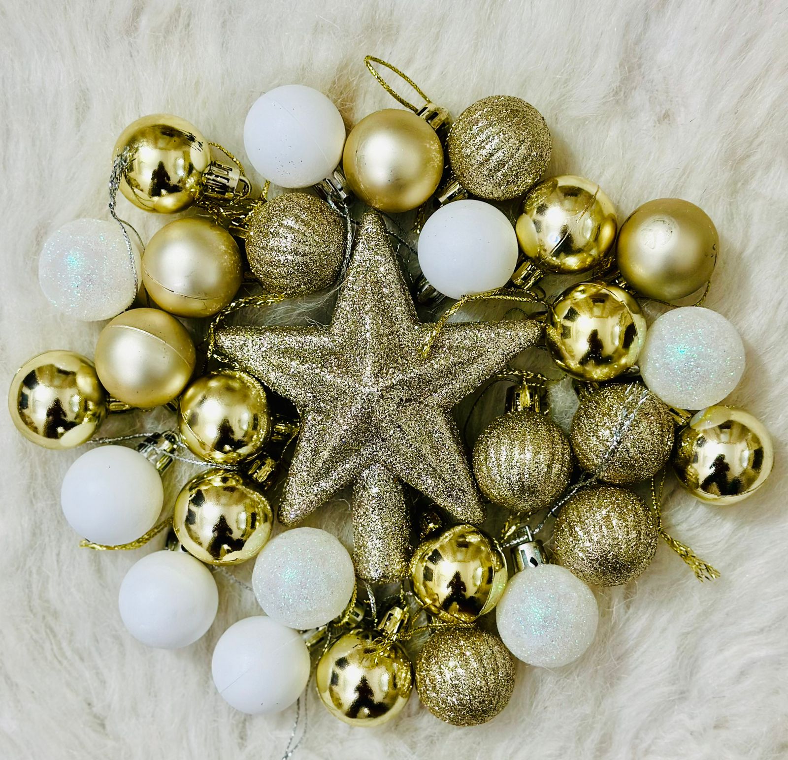 Assorted silver, gold, and white Christmas ornaments,