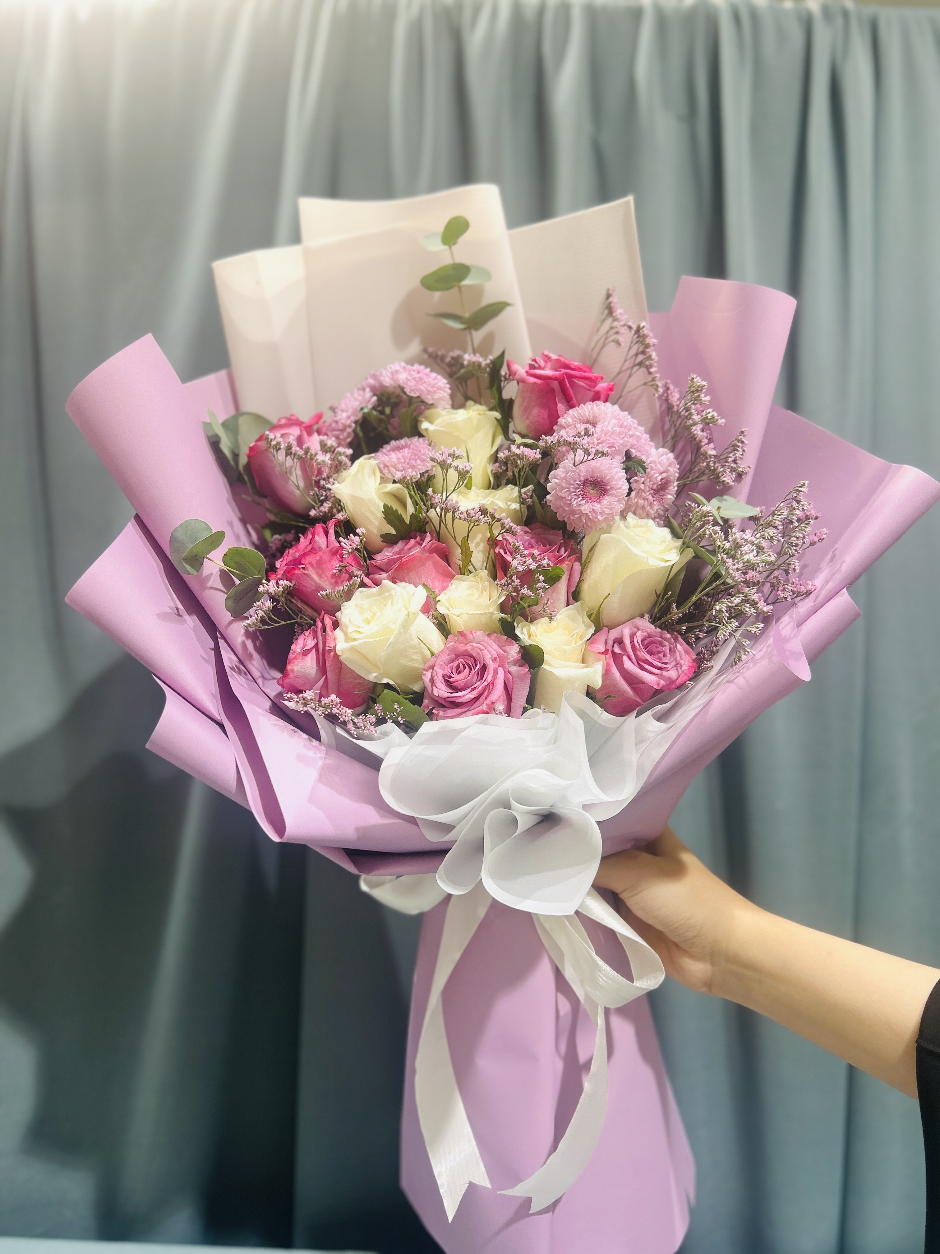 Purple and white mix hand bouquet