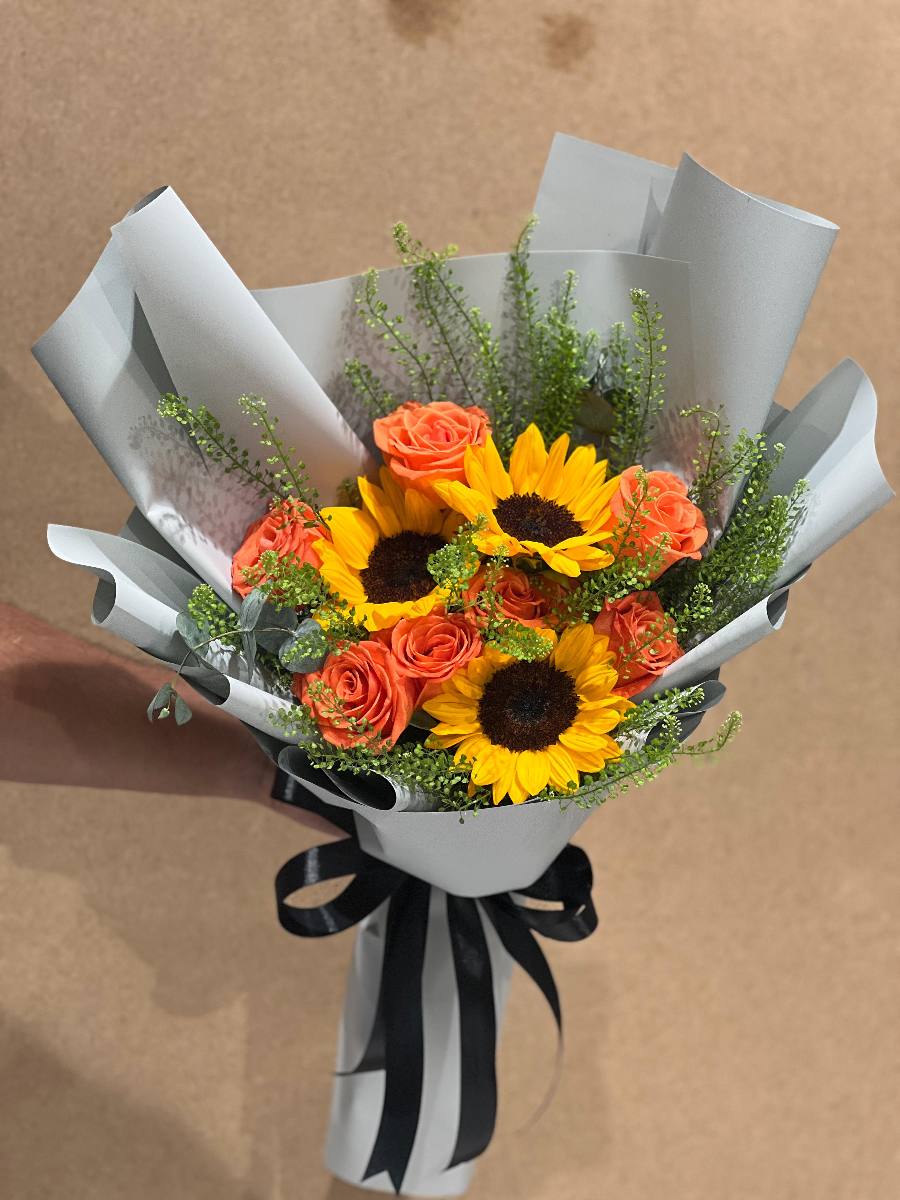 Sunflower with orange rose hand bouquet