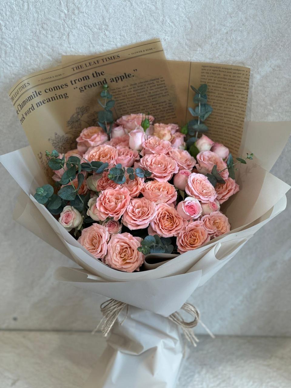 Lite orange baby roses hand bouquet