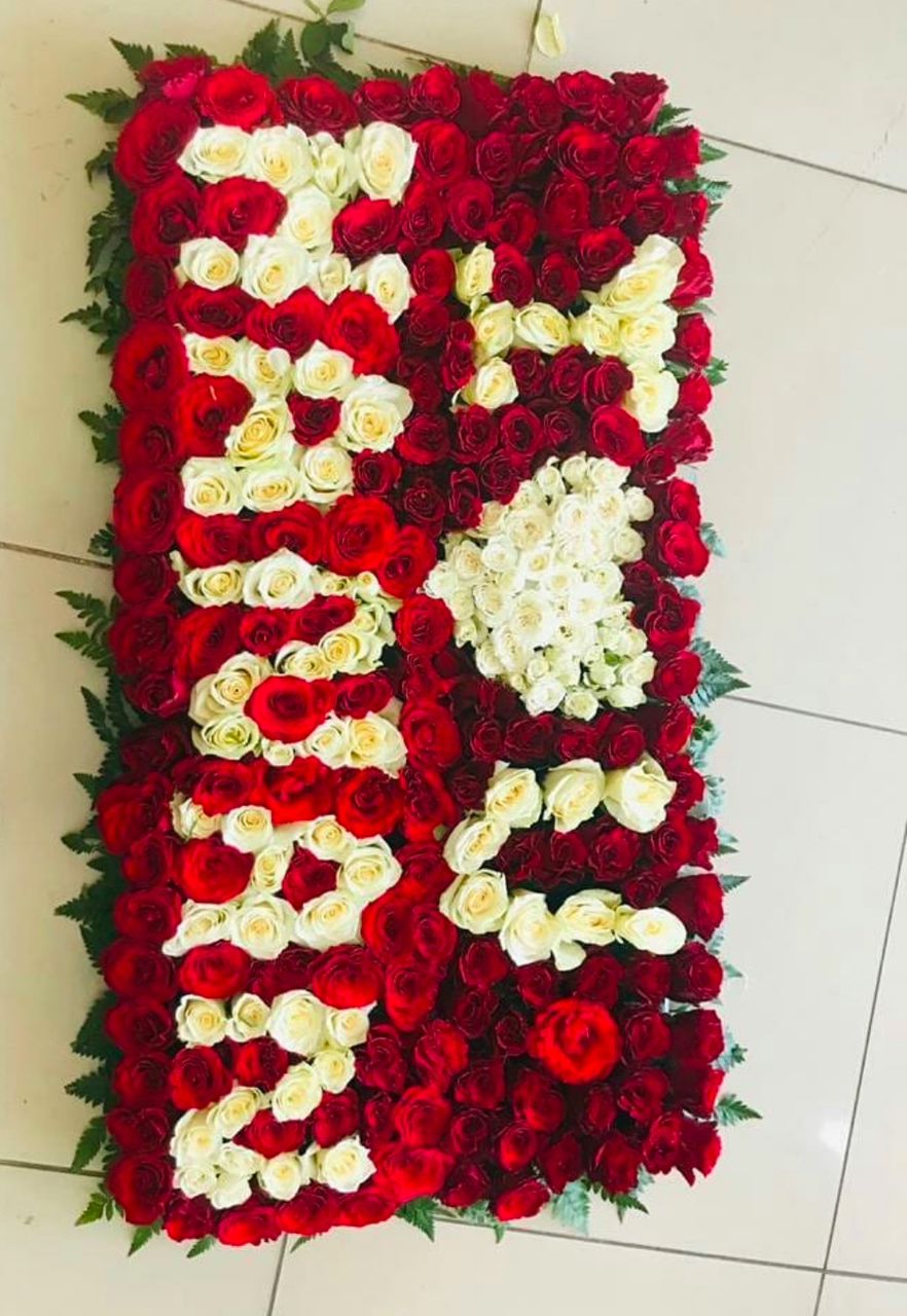 Name plate flowers  arrangement