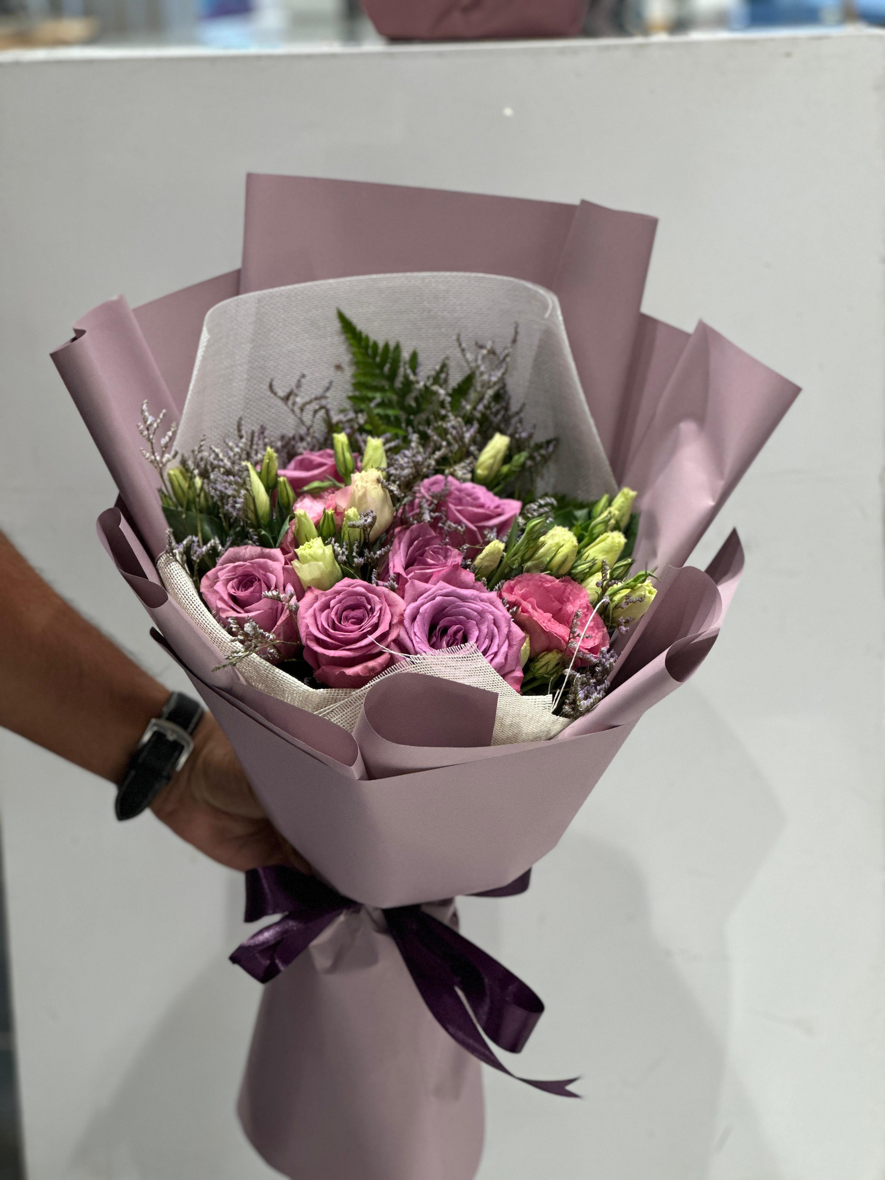 Purple and white  hand bouquet