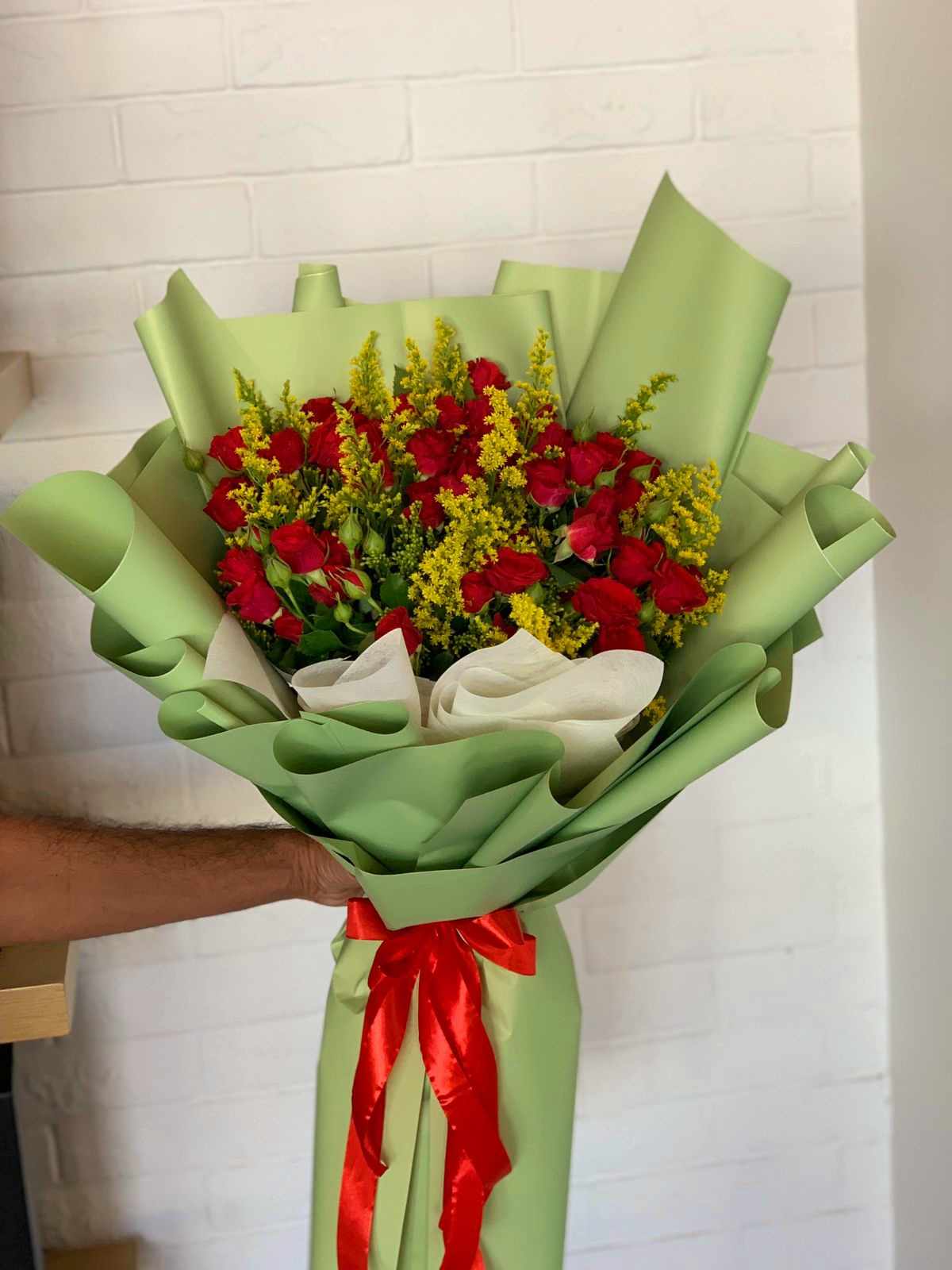 Red and lite green baby rose hand bouquet