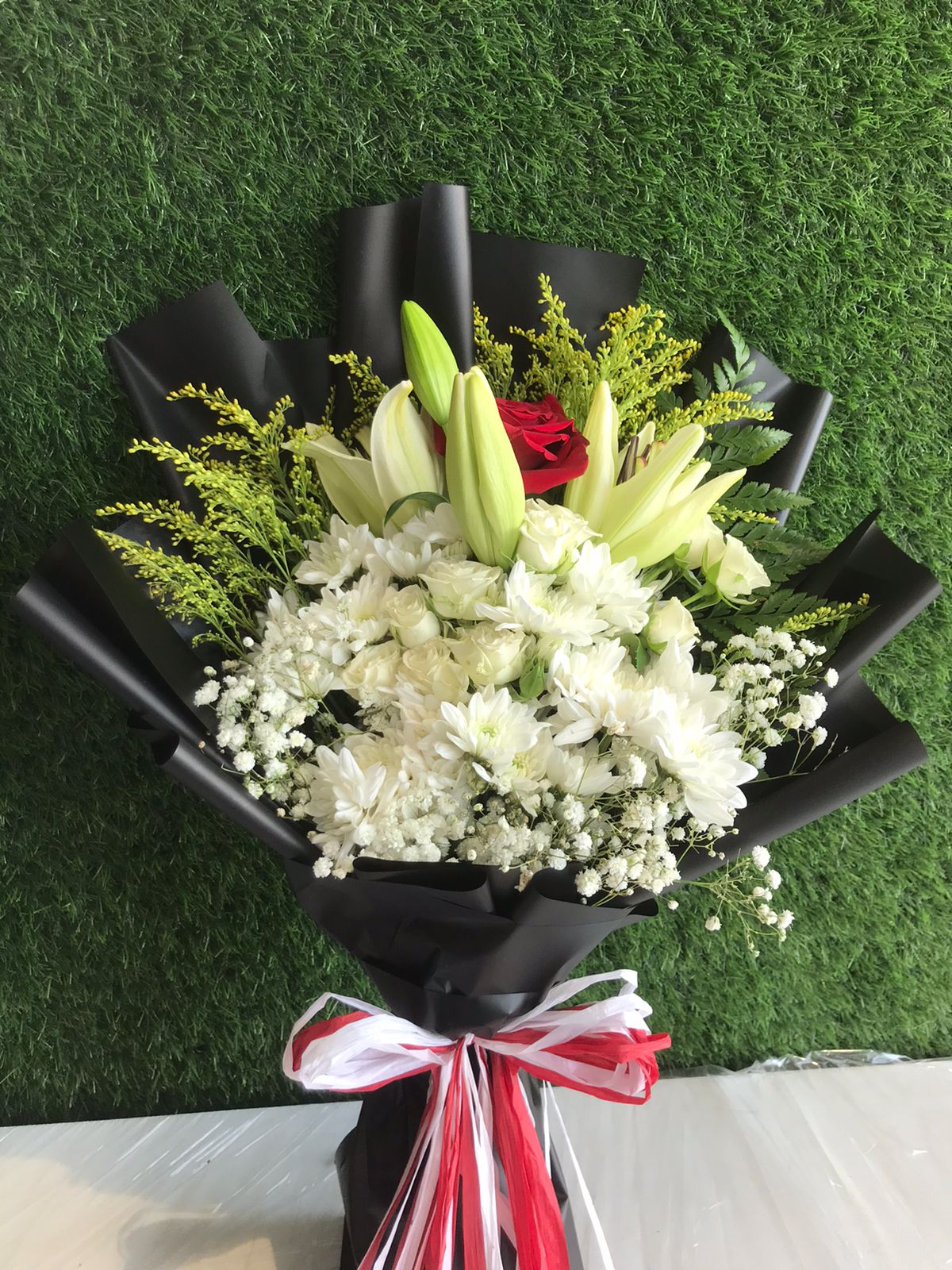 white black and red hand bouquet