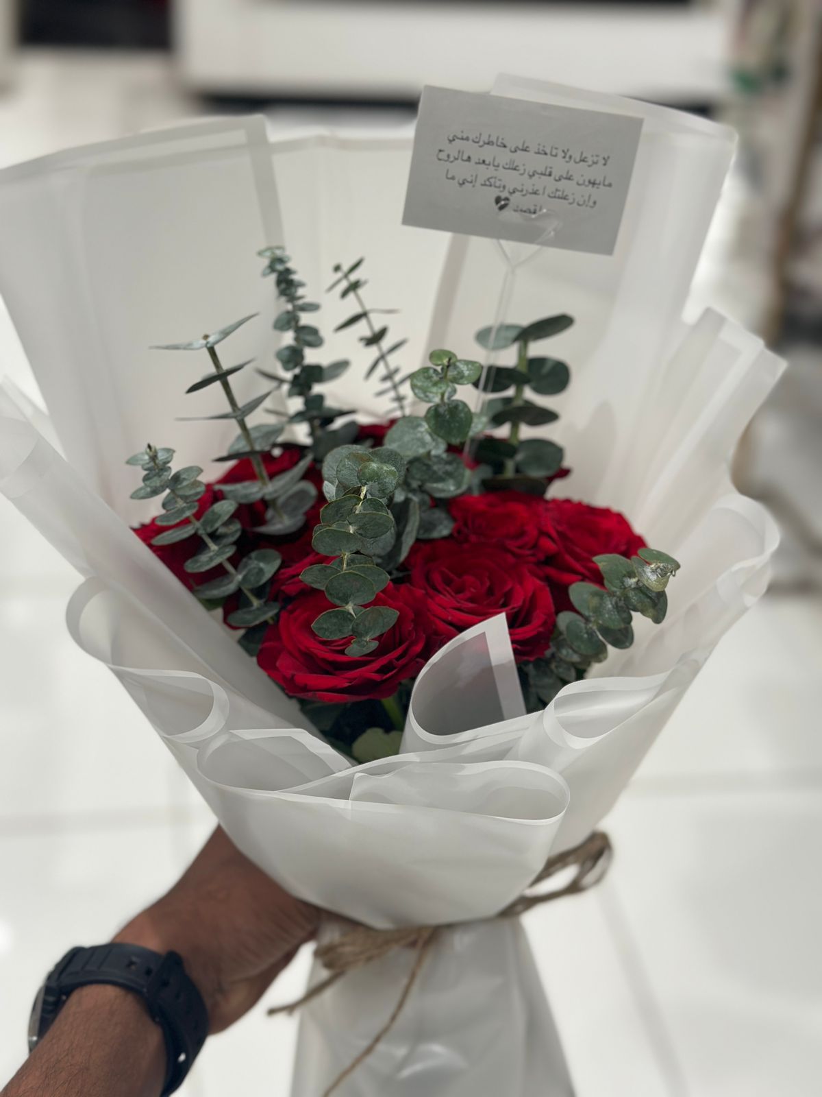 Red roses hand bouquet