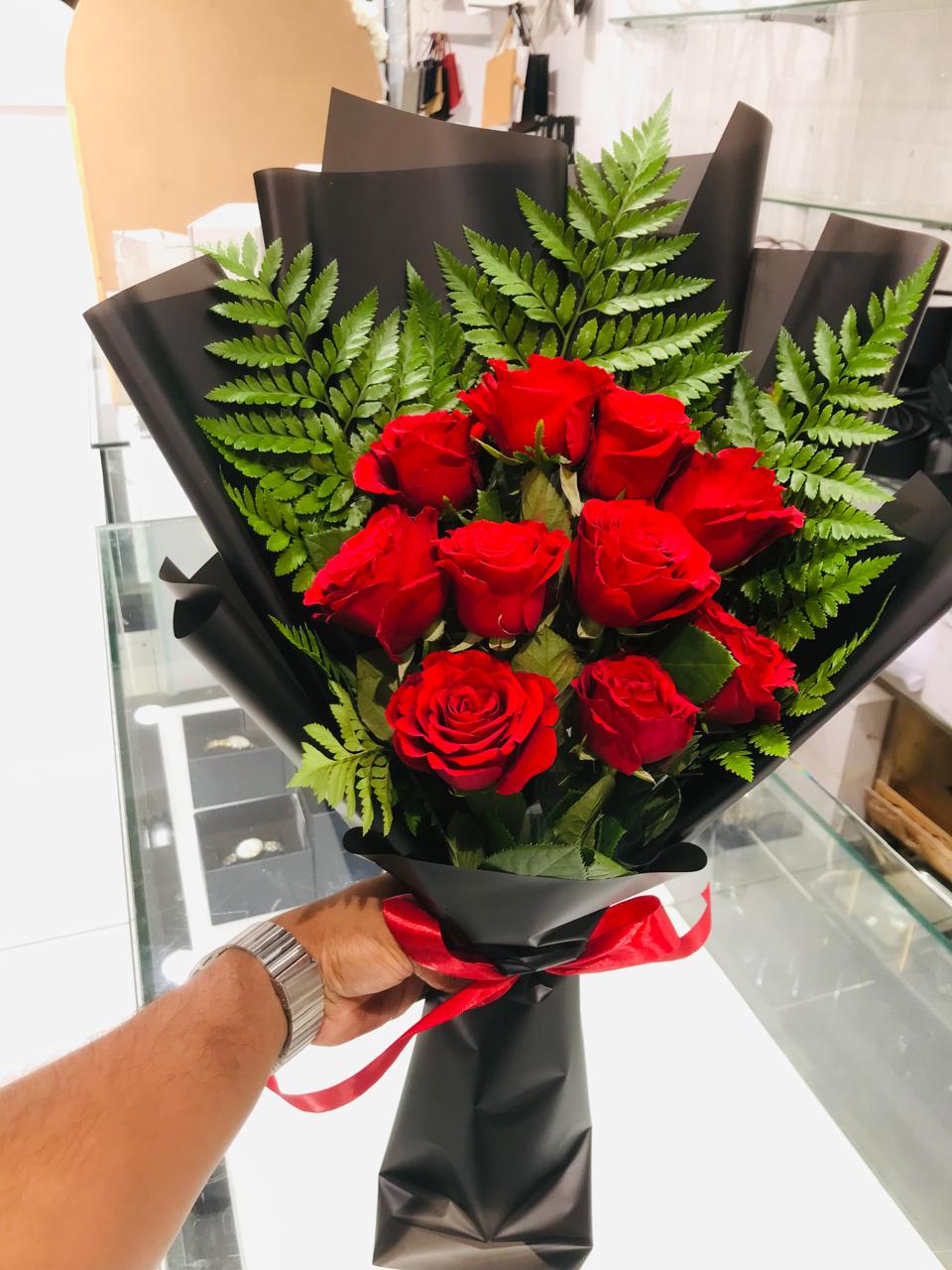 Red roses hand bouquet