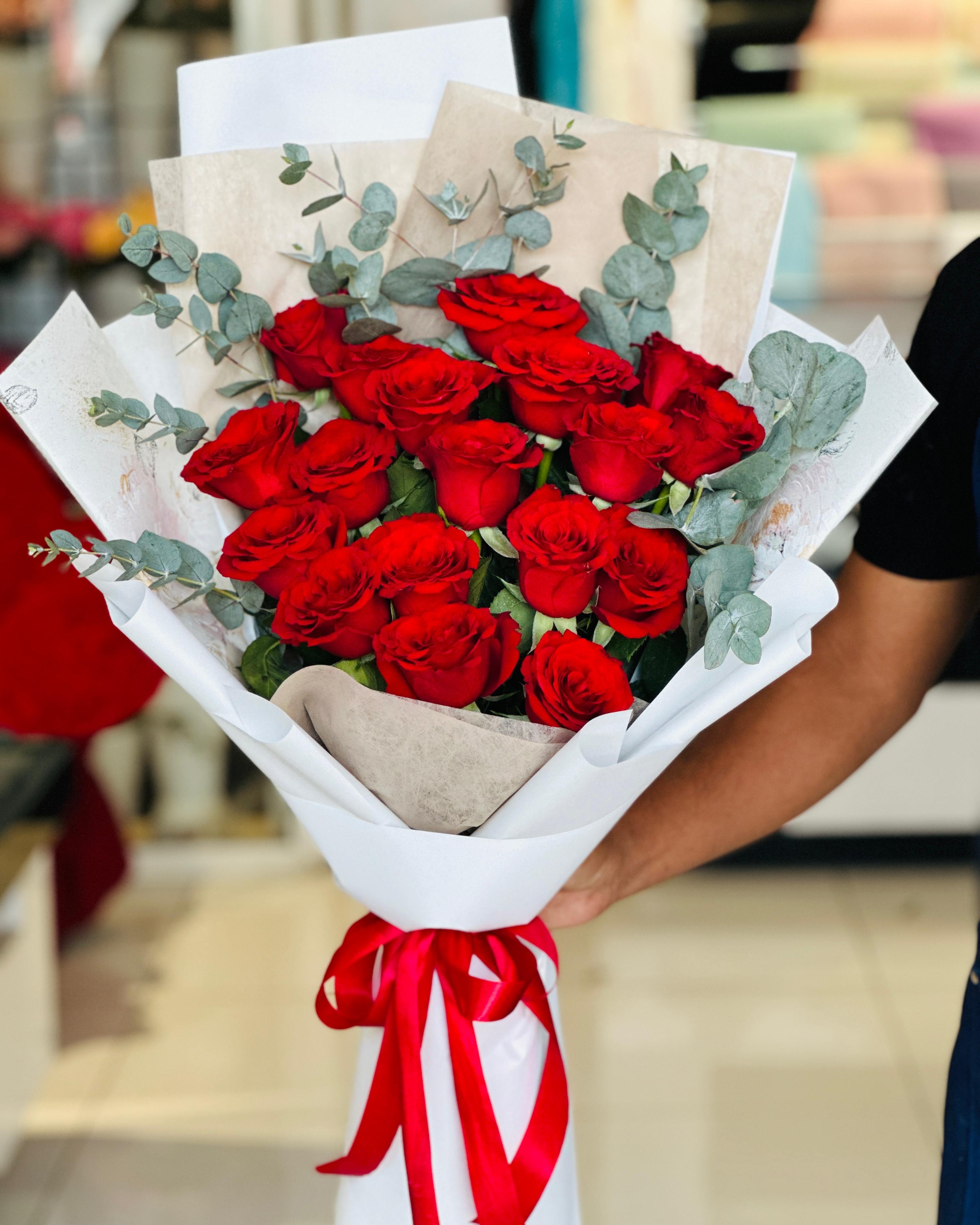 Red roses hand bouquet