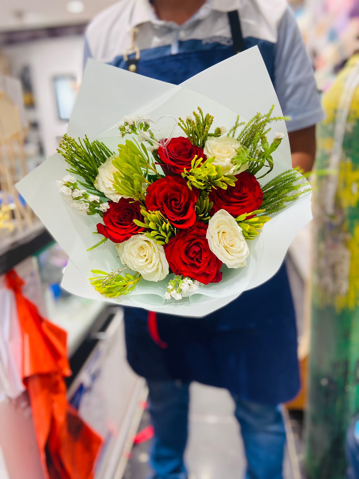 White and red flowers hand bouquet