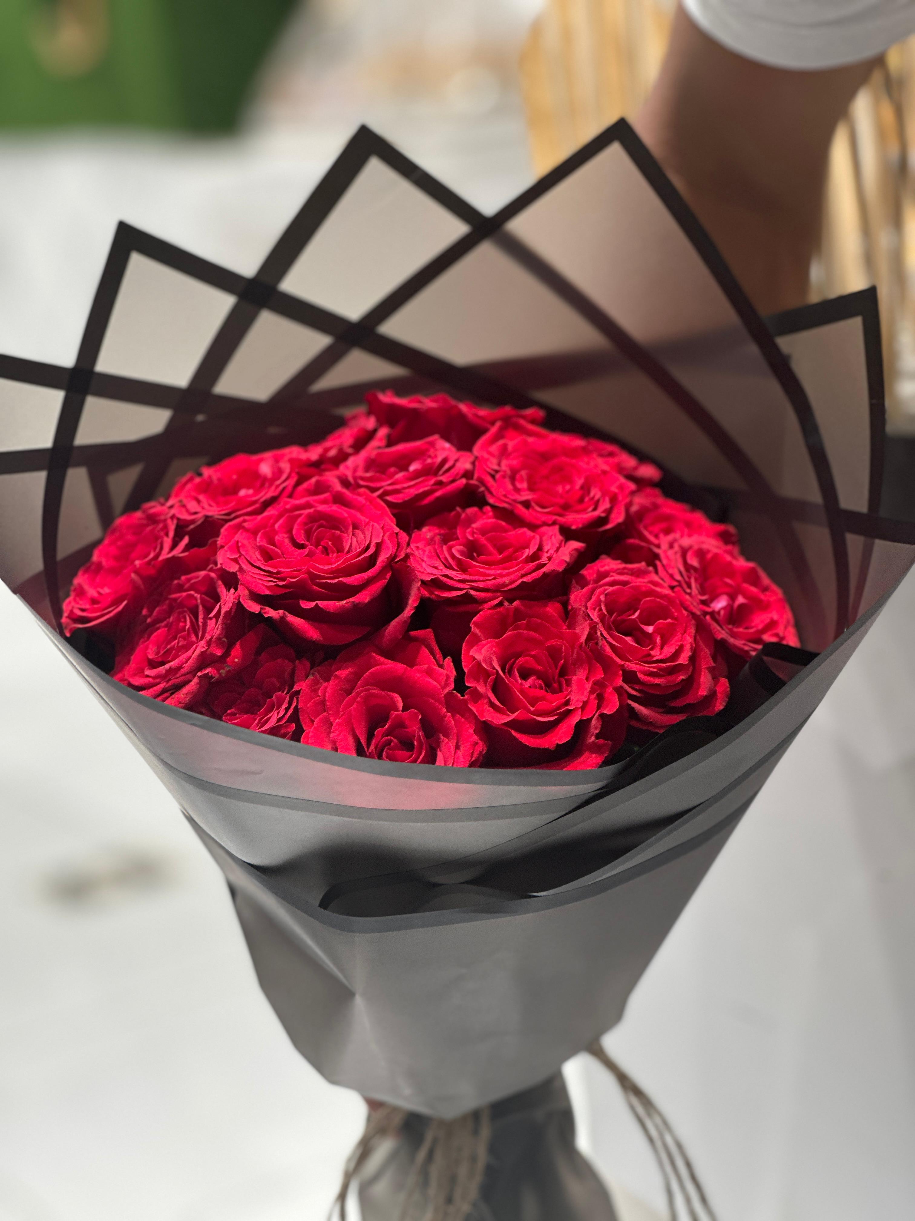 Red roses hand bouquet