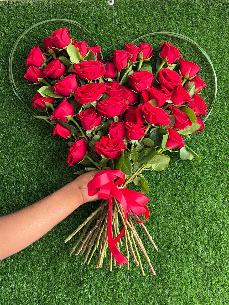 Red roses hand bouquet