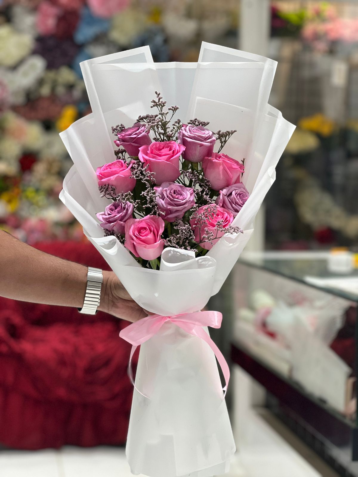 Purple and pink rose hand bouquet