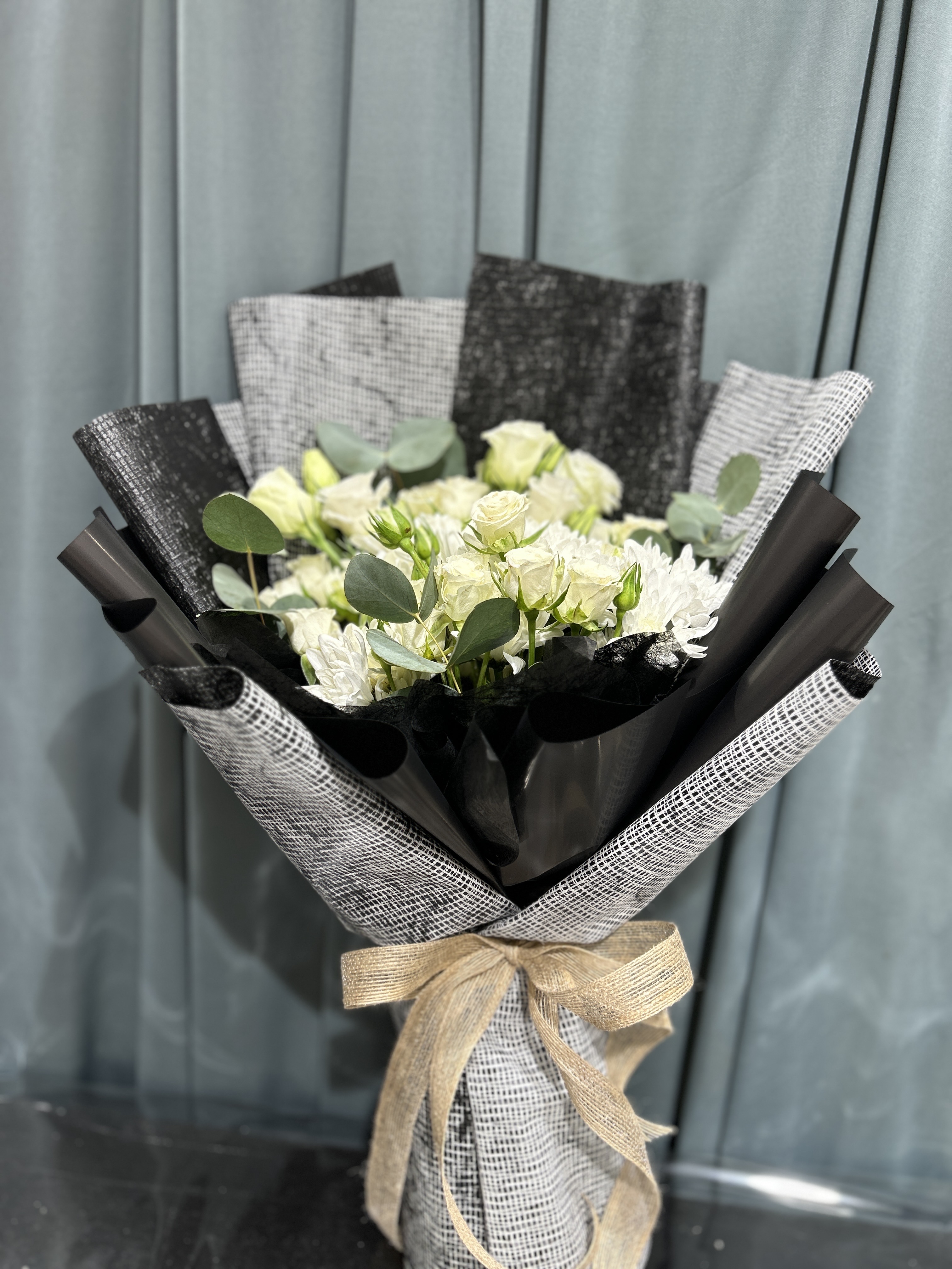 white and black hand bouquet