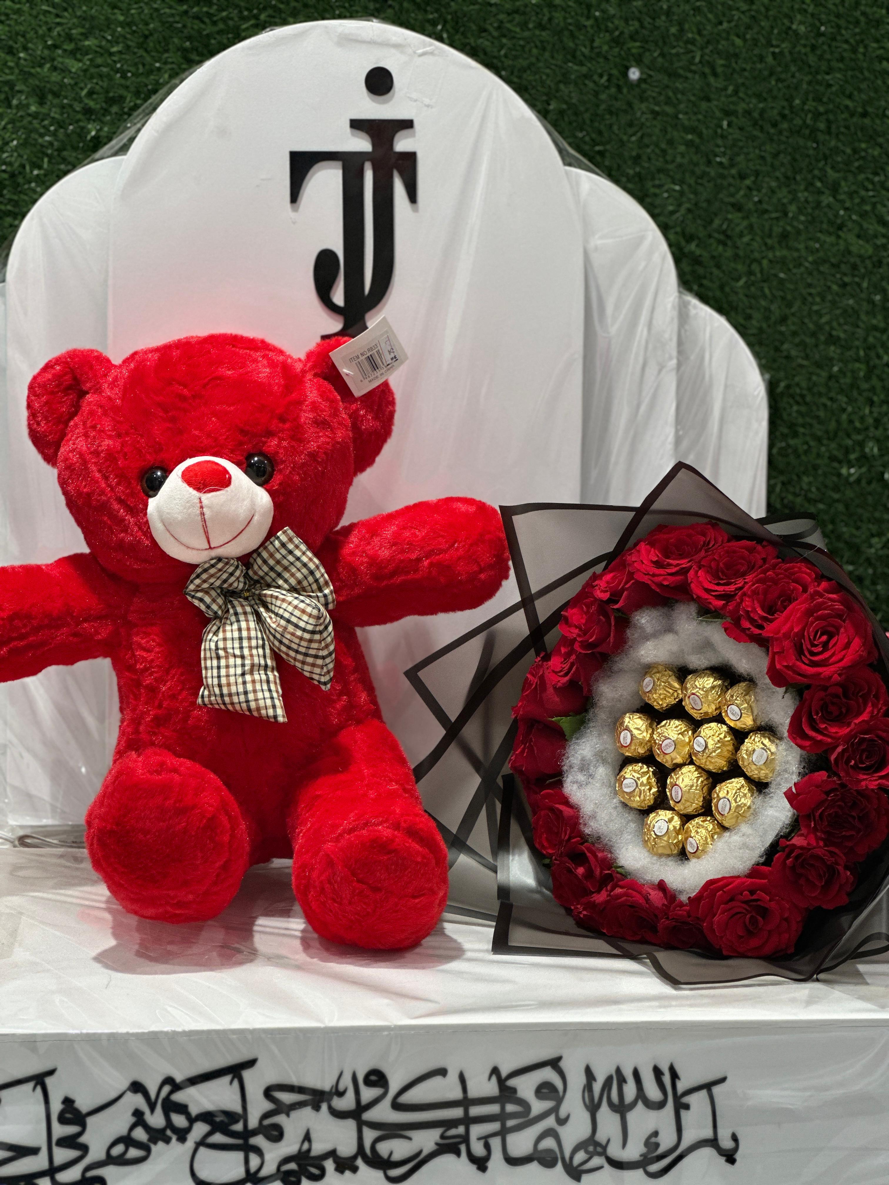 Teddy & chocolate within flowers bouquet