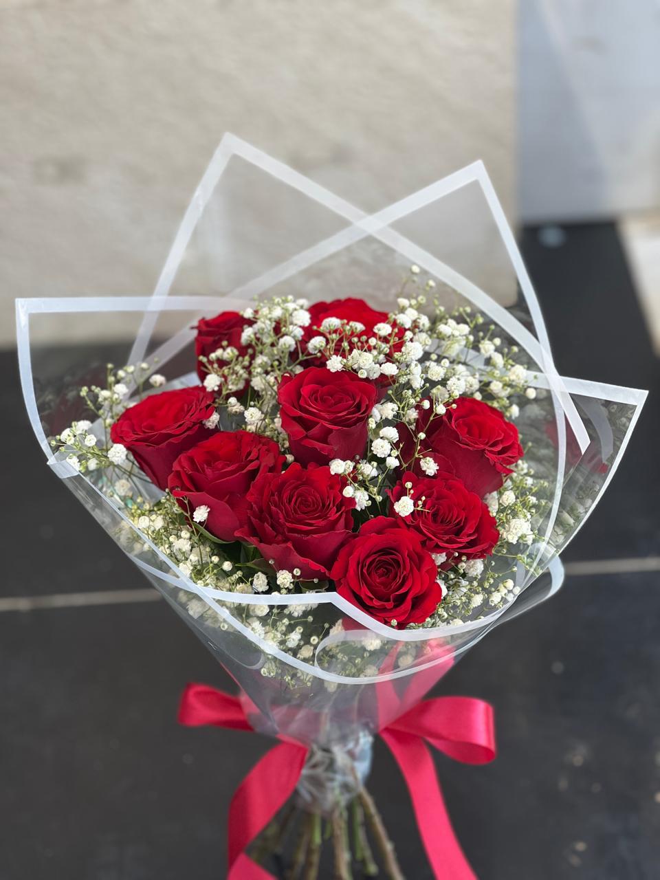 Red  roses clear paper wrapping