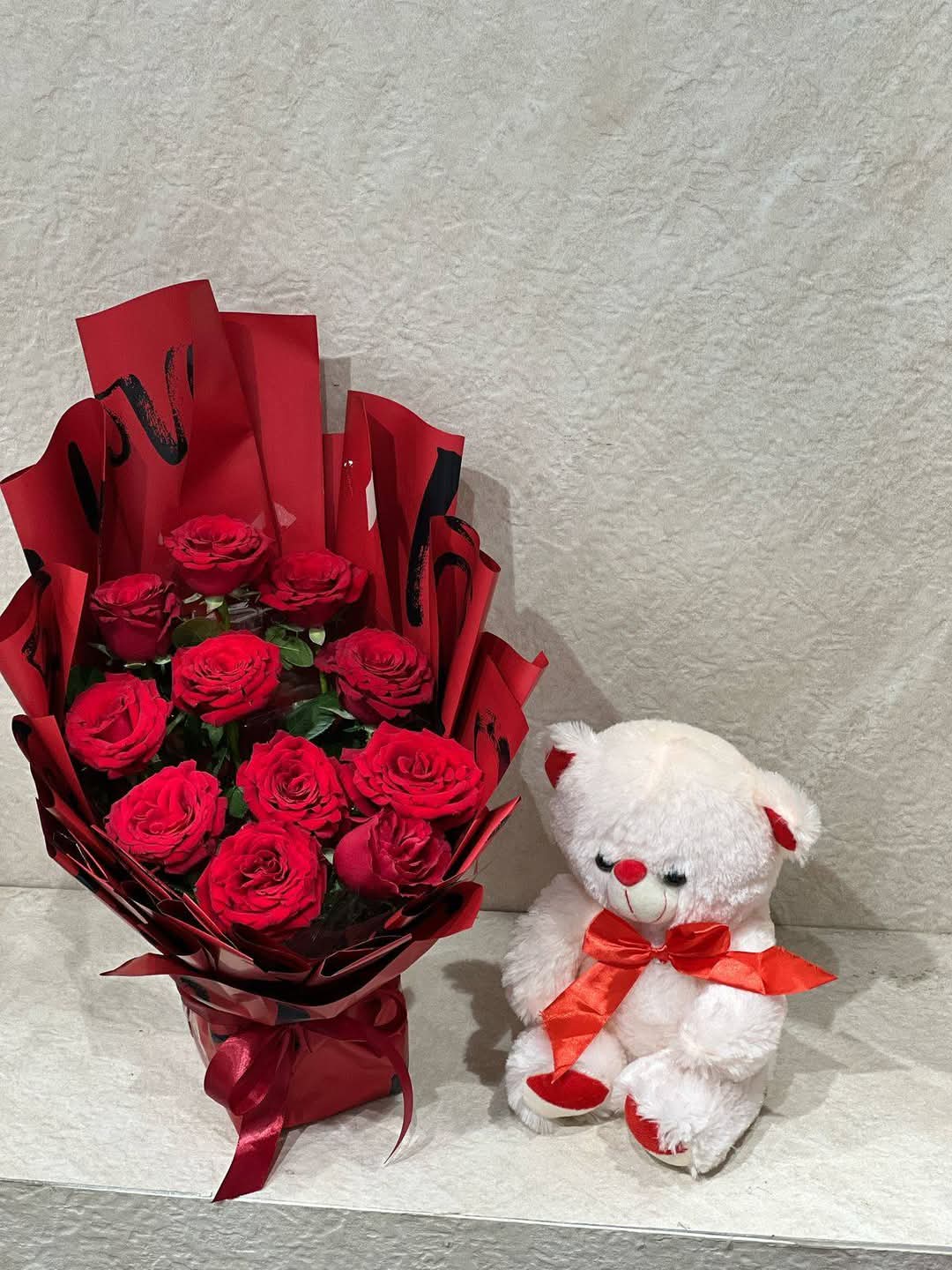 Red flowers with small teddy (red,white, pink,blue?